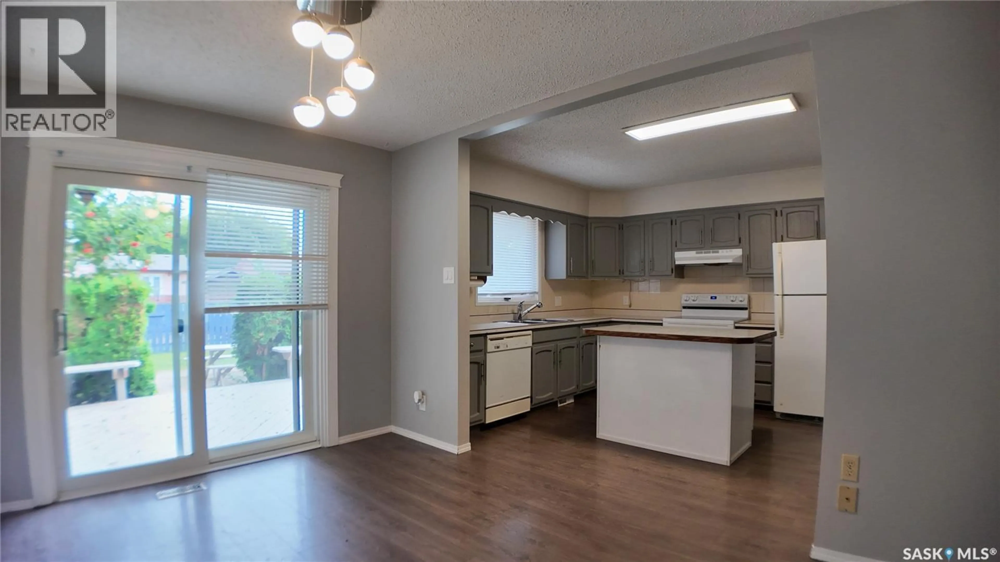 Open concept kitchen, wood/laminate floor for 10716 MEIGHEN CRESCENT, North Battleford Saskatchewan S9A3L1