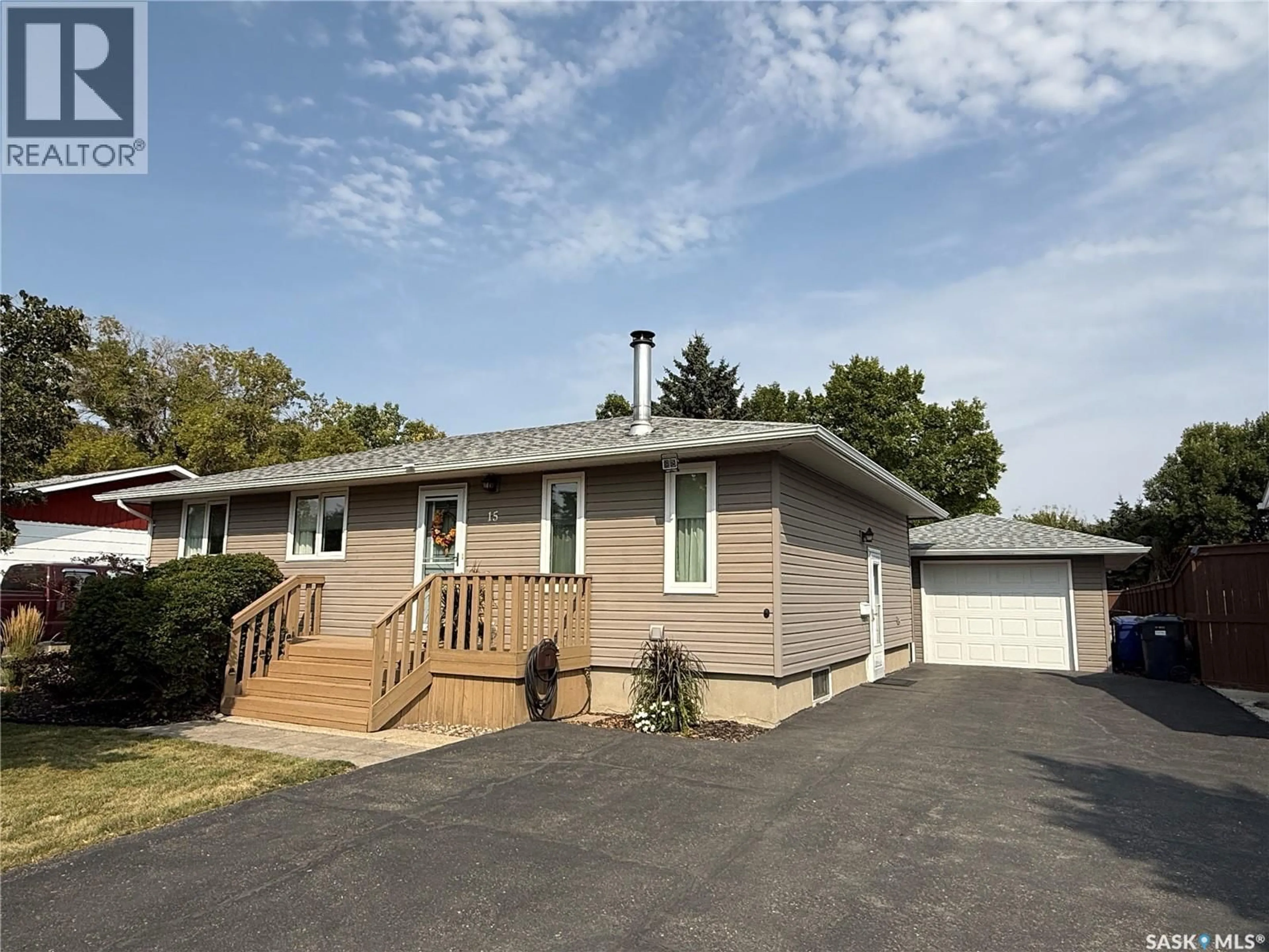 Home with vinyl exterior material, street for 15 MITCHELL CRESCENT, Weyburn Saskatchewan S4H2M3