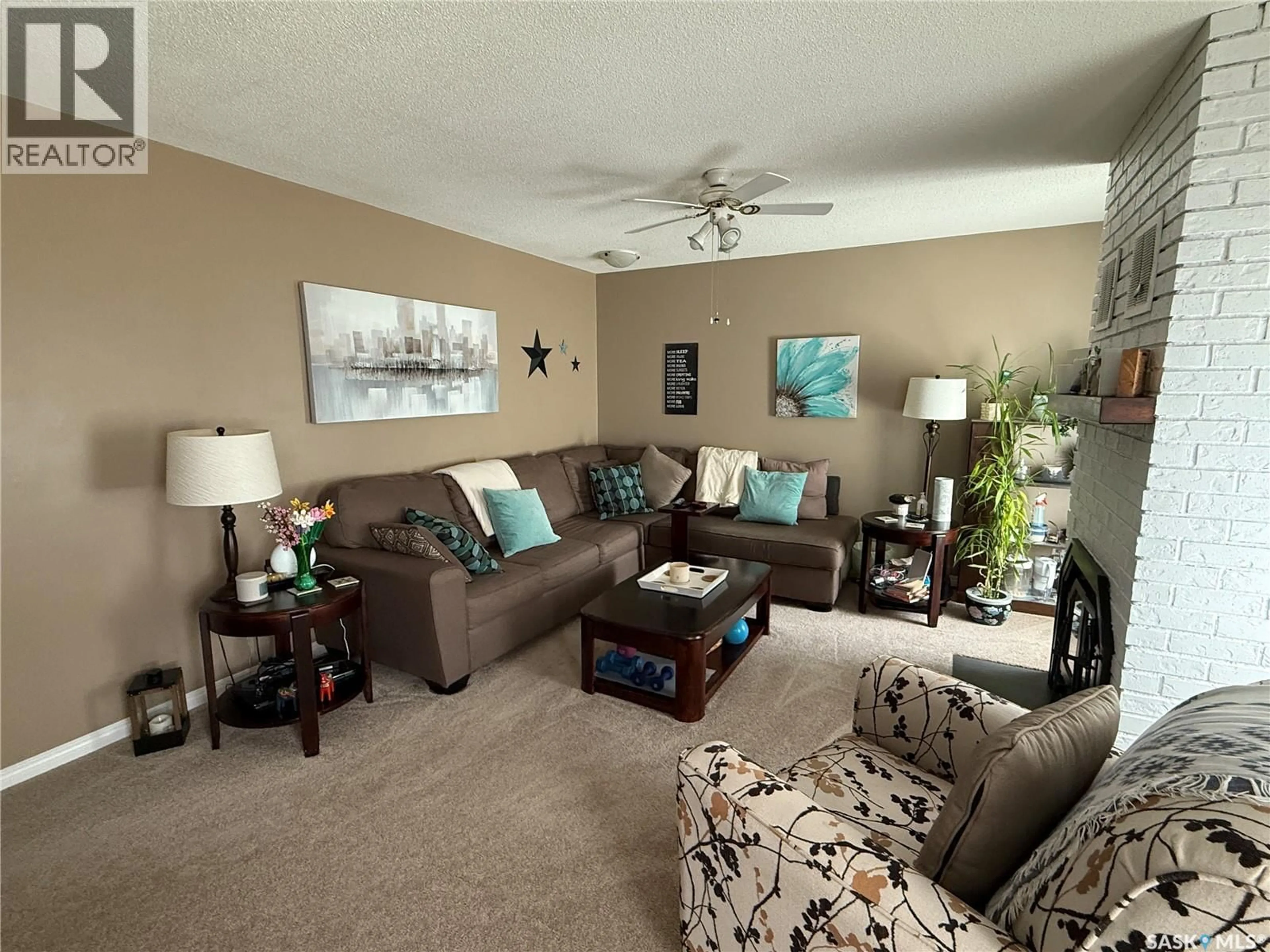 Living room with furniture, unknown for 15 MITCHELL CRESCENT, Weyburn Saskatchewan S4H2M3