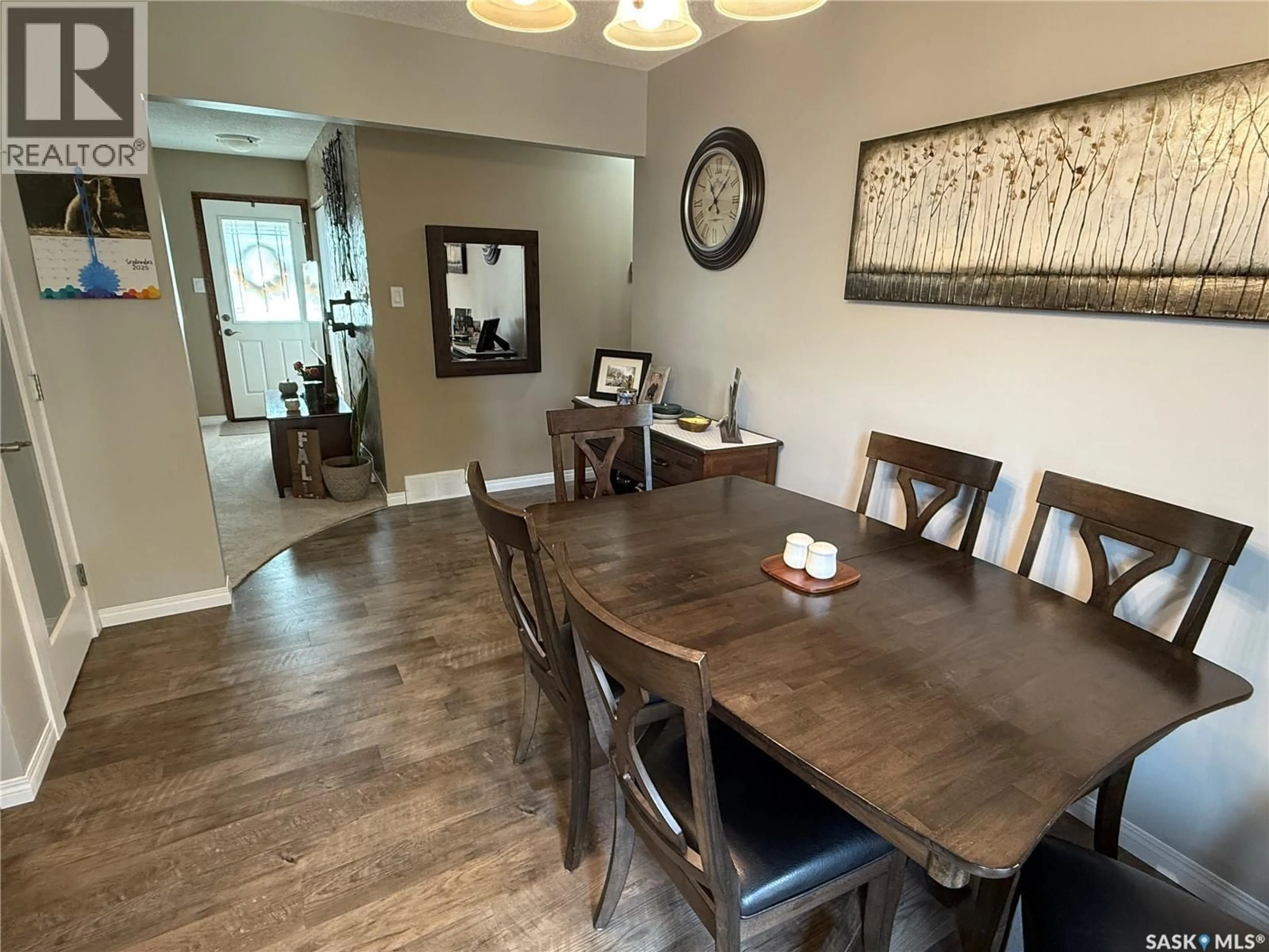 Dining room, wood/laminate floor for 15 MITCHELL CRESCENT, Weyburn Saskatchewan S4H2M3