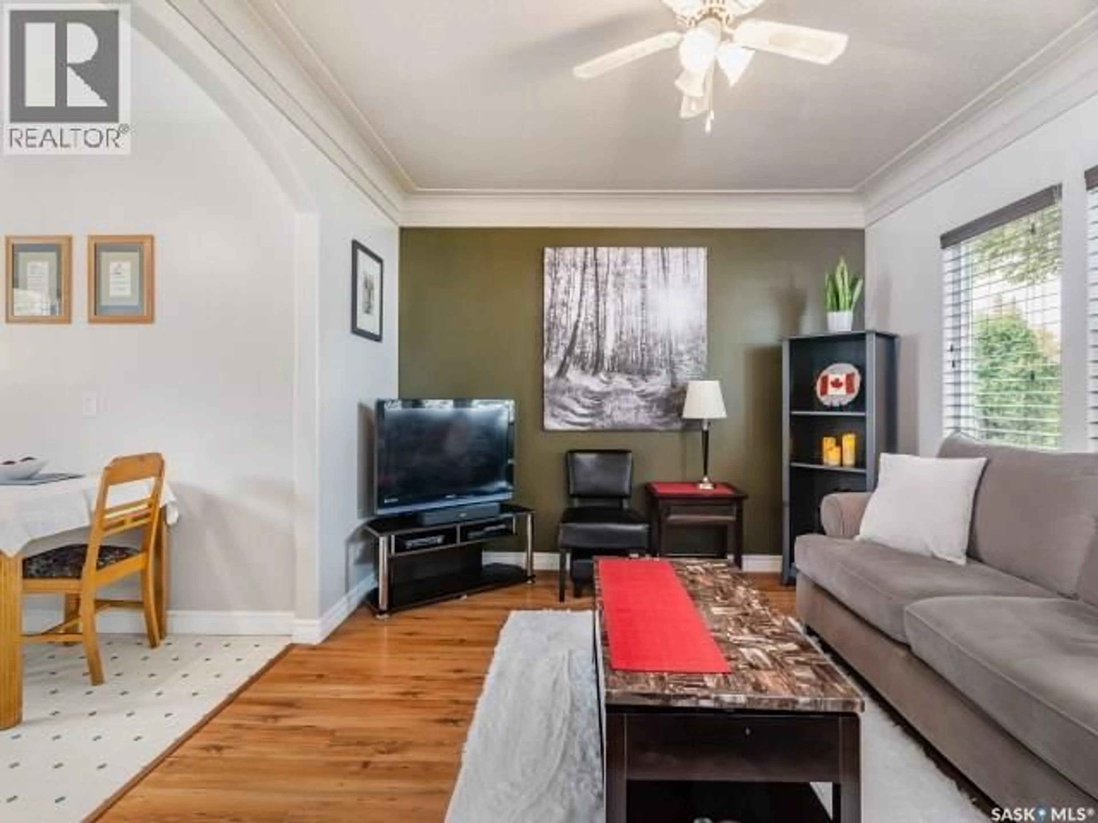 Living room with furniture, wood/laminate floor for 226 Y AVENUE, Saskatoon Saskatchewan S7M3J5