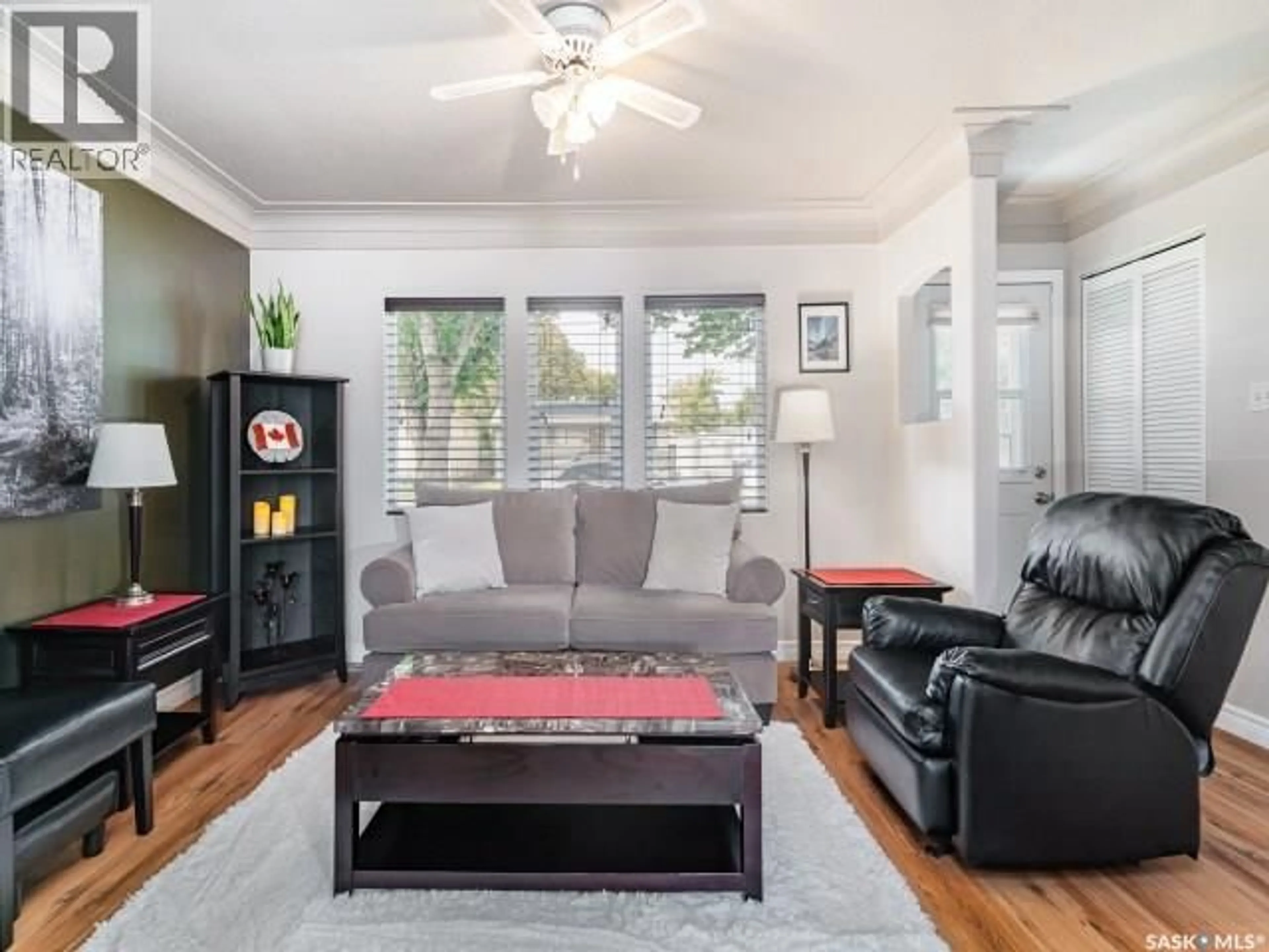 Living room with furniture, wood/laminate floor for 226 Y AVENUE, Saskatoon Saskatchewan S7M3J5