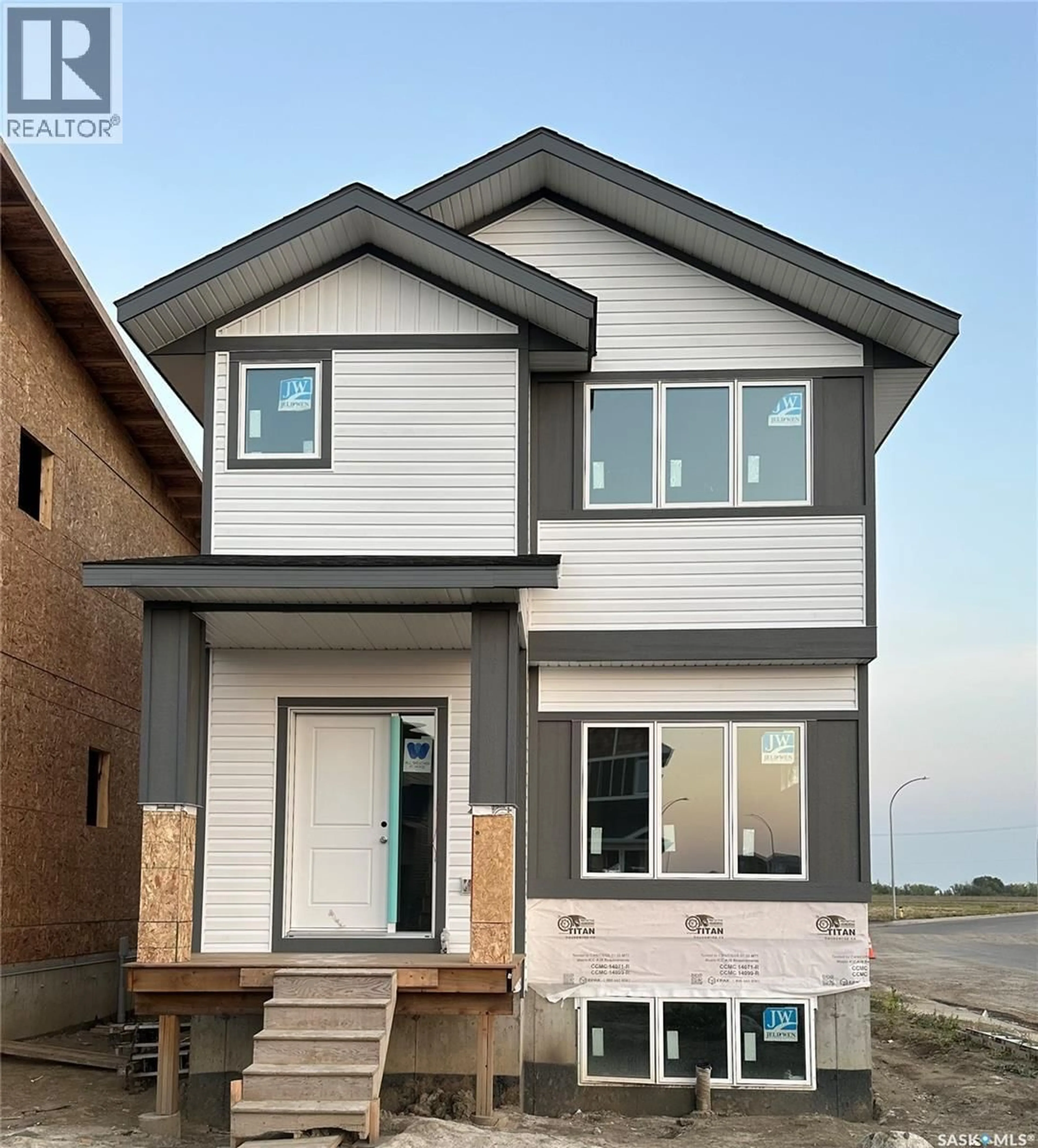 Home with vinyl exterior material, street for 400 BESNARD CRESCENT, Martensville Saskatchewan S0K2T1