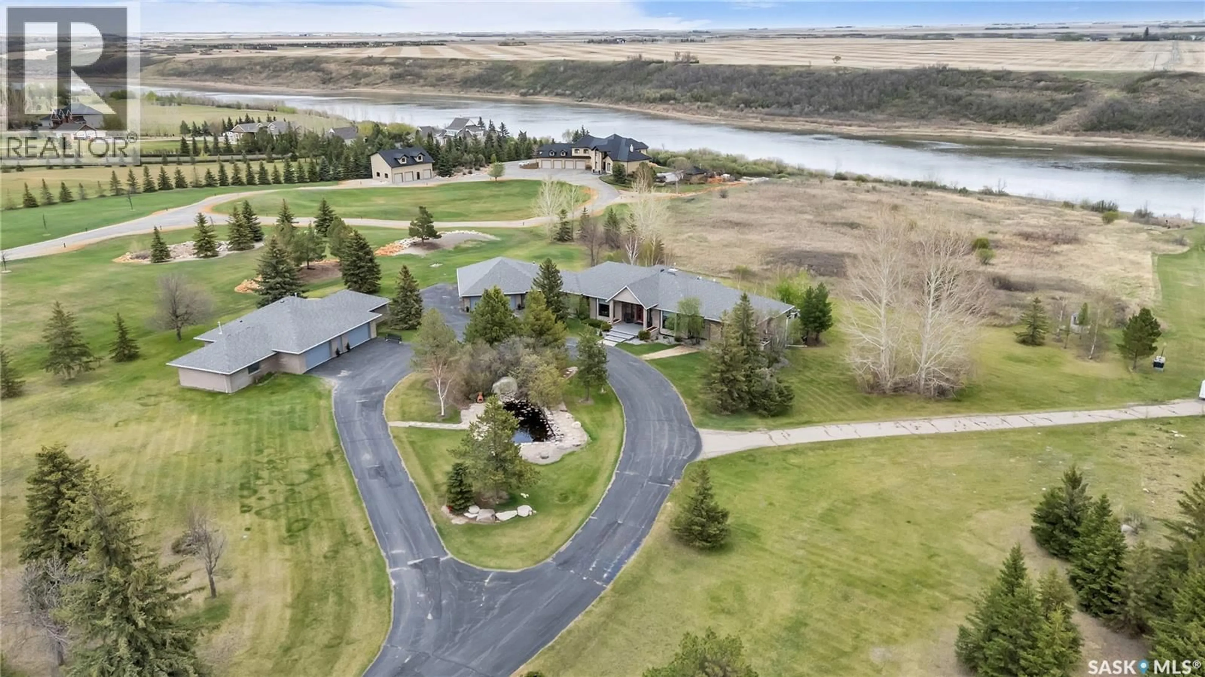 A pic from outside/outdoor area/front of a property/back of a property/a pic from drone, water/lake/river/ocean view for 48 CATHEDRAL BLUFFS ROAD, Corman Park Rm No. 344 Saskatchewan S7P1A1