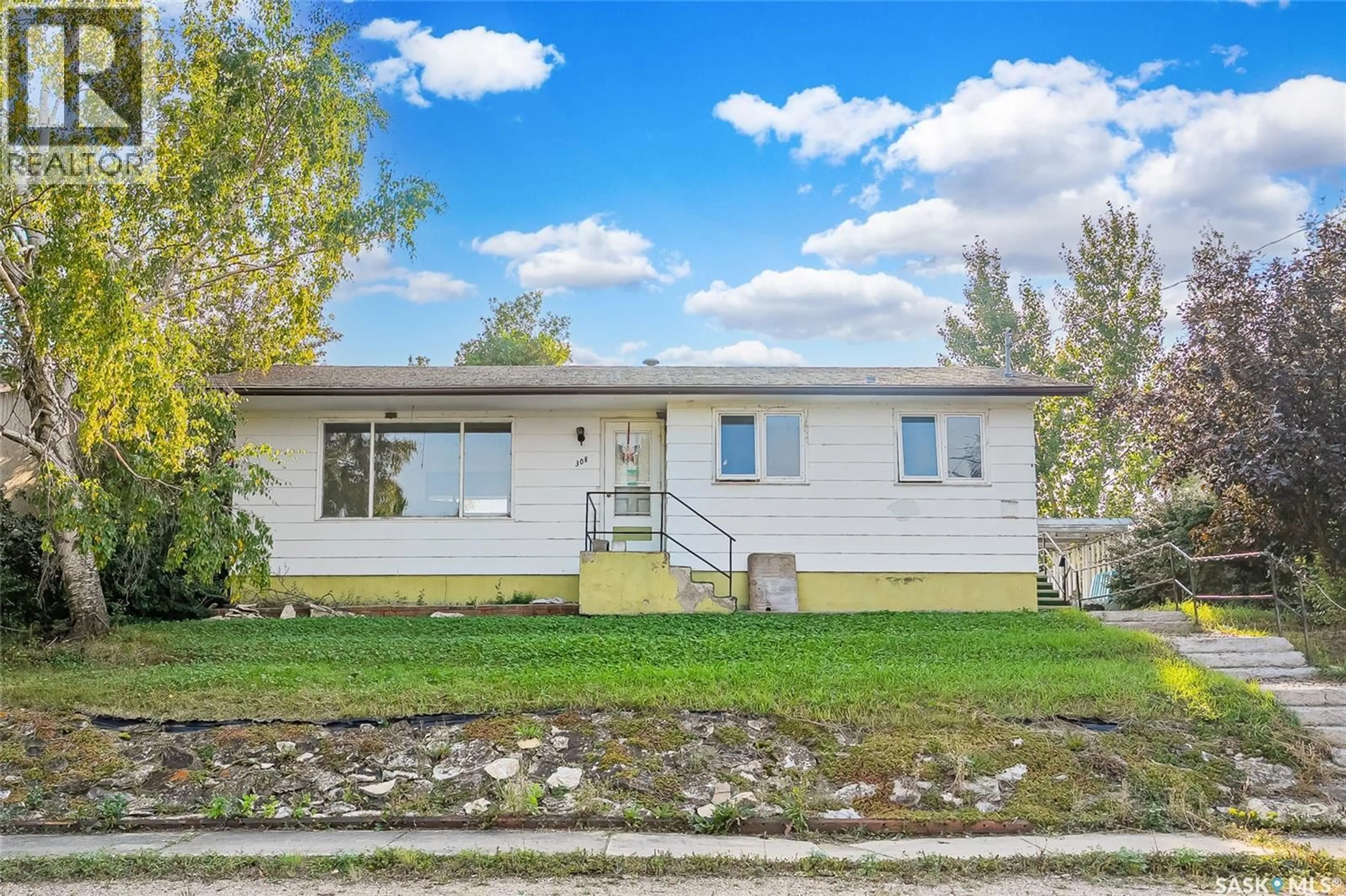 Home with vinyl exterior material, street for 308 3RD AVENUE, Young Saskatchewan S0K4Y0