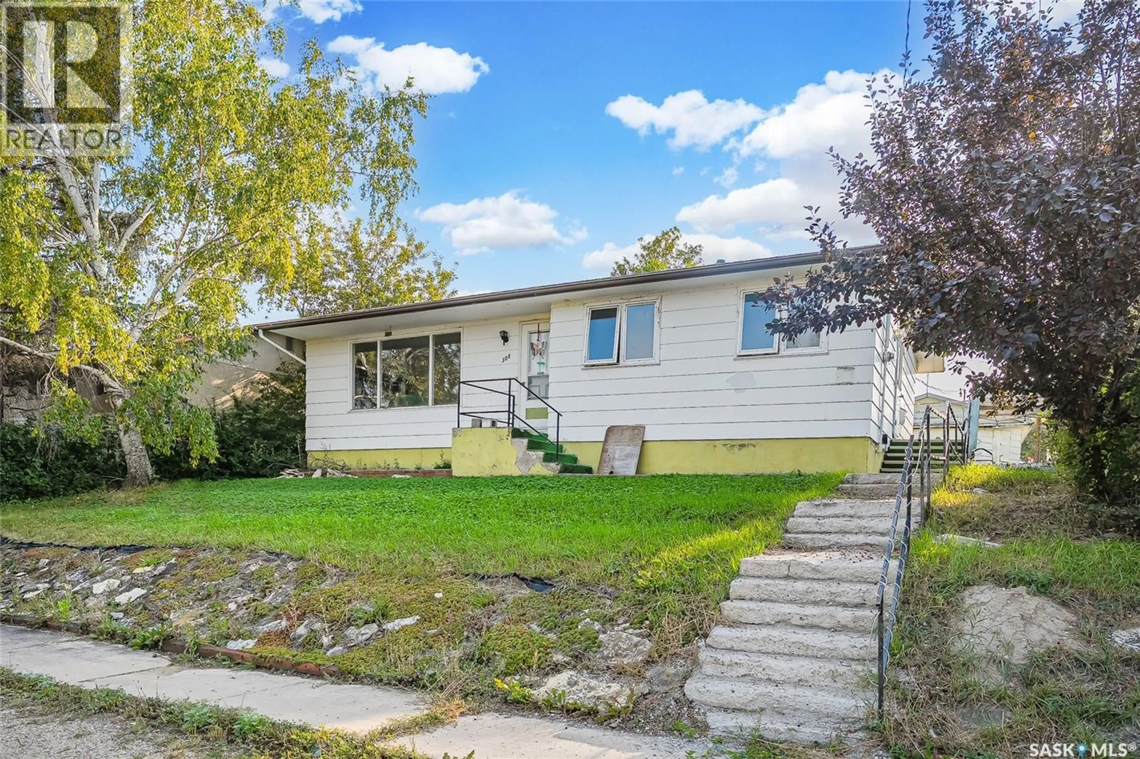 Home with vinyl exterior material, street for 308 3RD AVENUE, Young Saskatchewan S0K4Y0