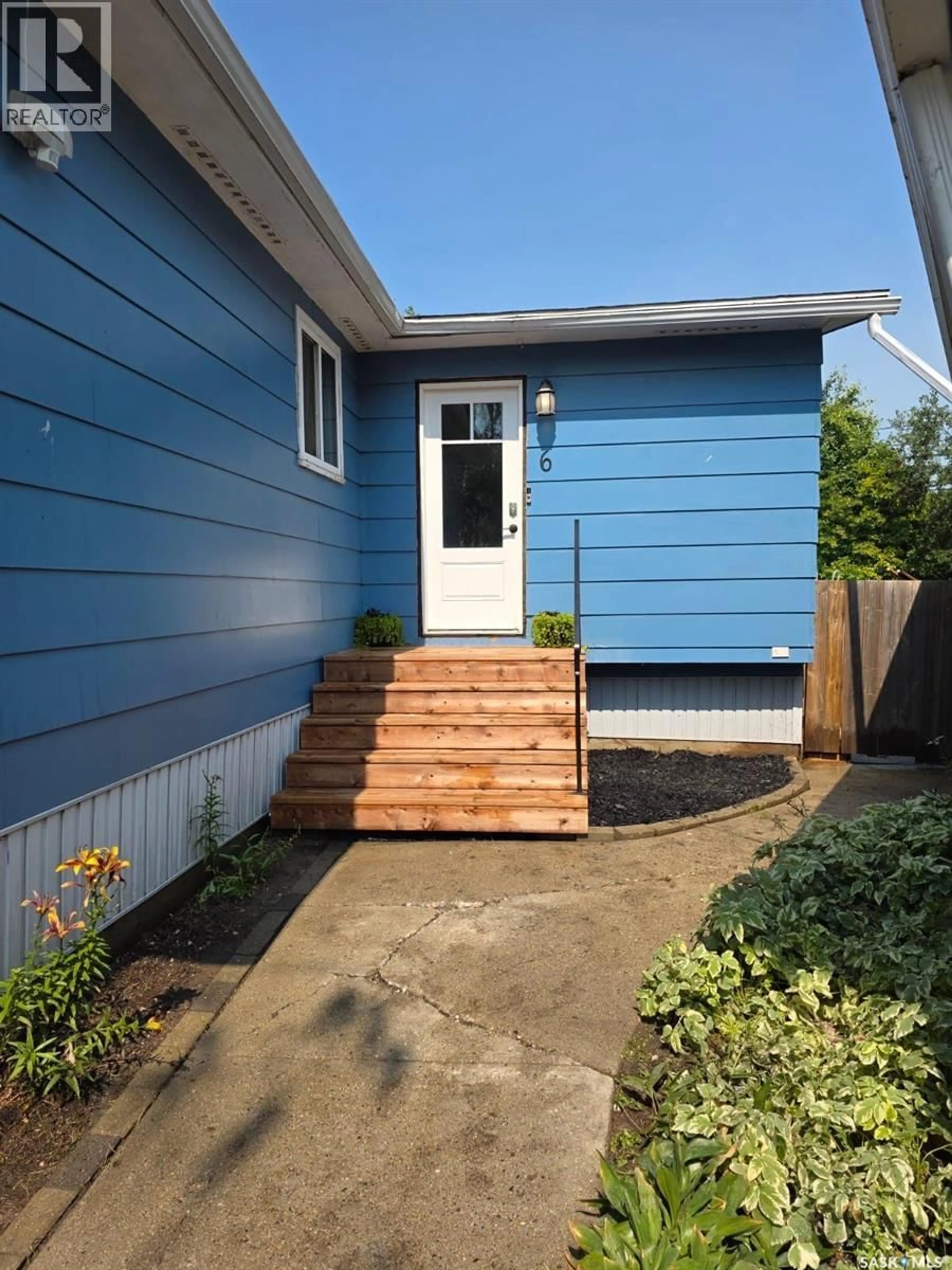 Home with vinyl exterior material, street for 6 4TH AVENUE, Allan Saskatchewan S0K0C0