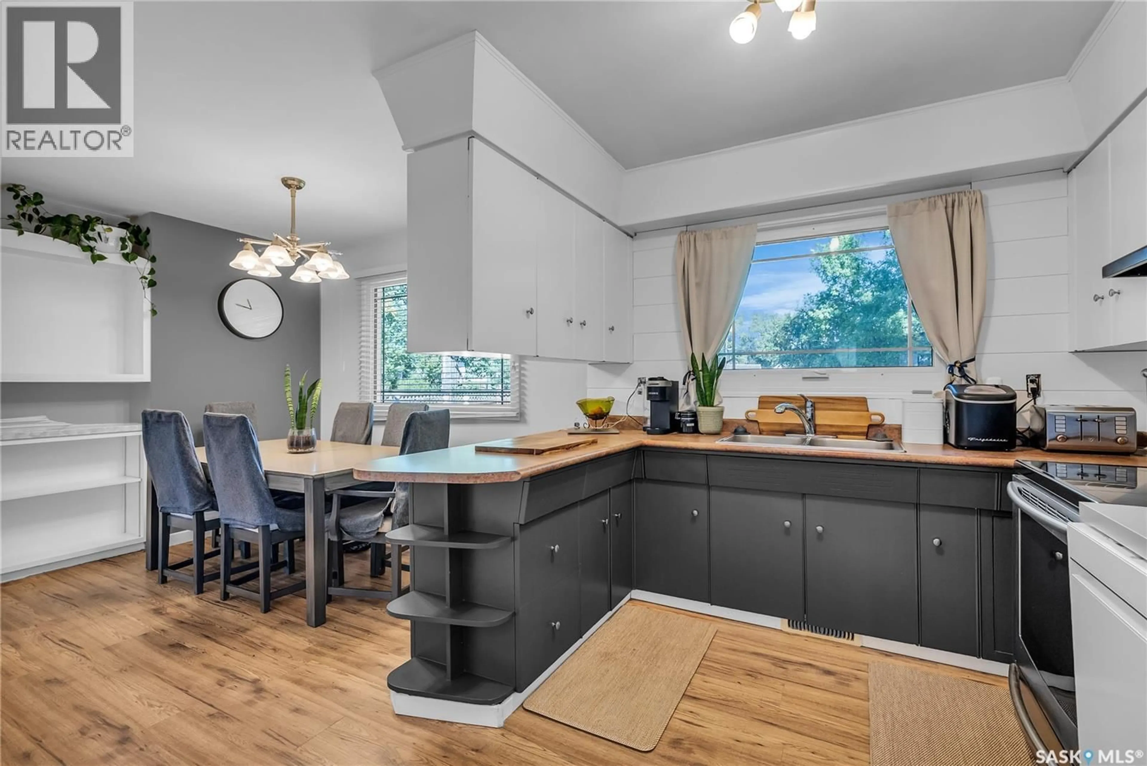 Open concept kitchen, wood/laminate floor for 217 PRINCE STREET, Imperial Saskatchewan S0G2J0