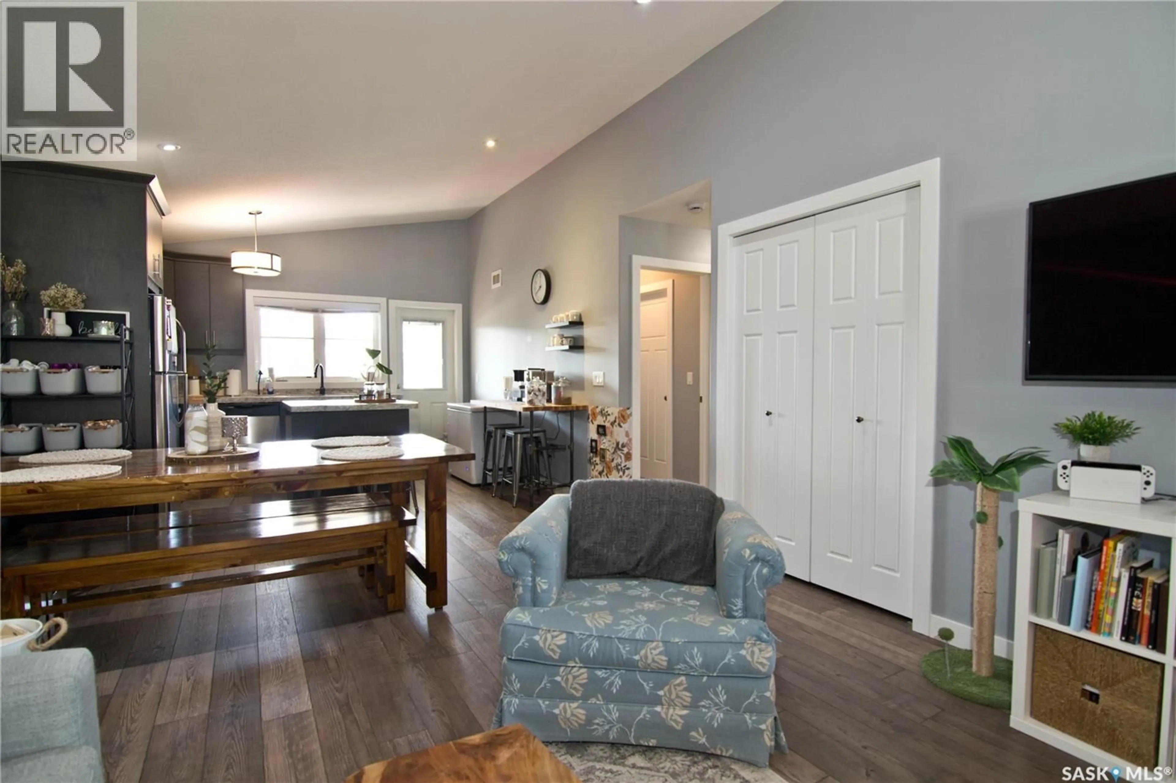 Open concept kitchen, wood/laminate floor for E - 4140 GREEN APPLE DRIVE, Regina Saskatchewan S4V1S1