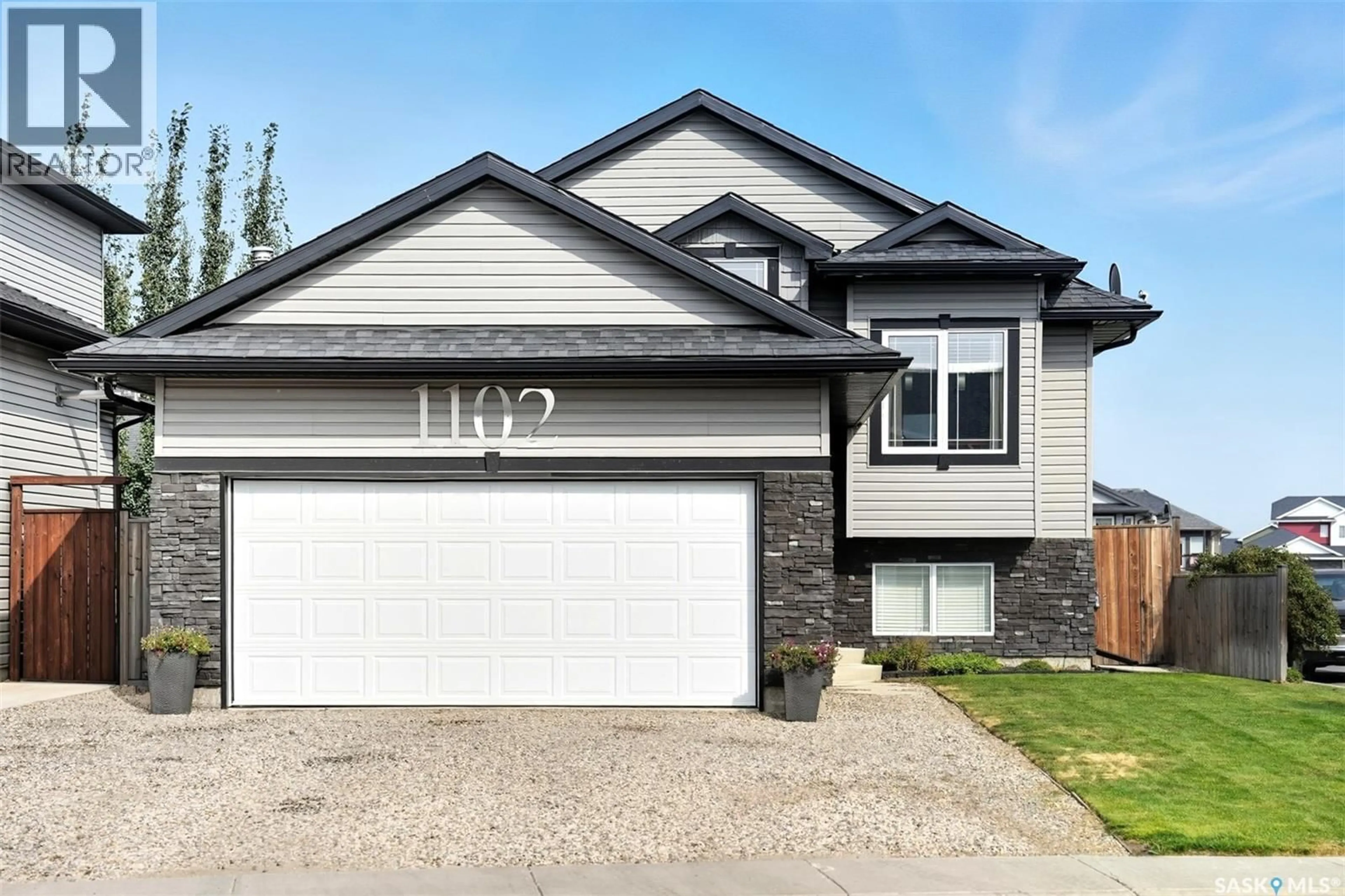Home with vinyl exterior material, street for 1102 HARGREAVES WAY, Saskatoon Saskatchewan S7R0H2