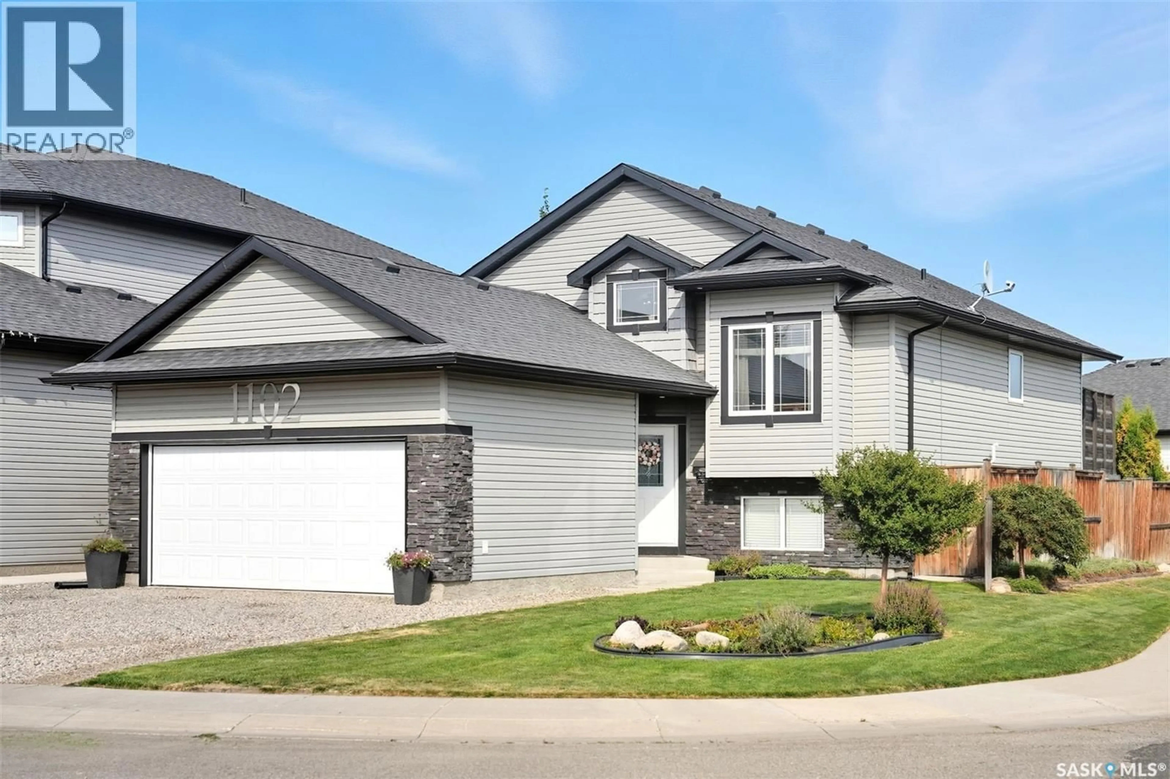 Home with brick exterior material, street for 1102 HARGREAVES WAY, Saskatoon Saskatchewan S7R0H2
