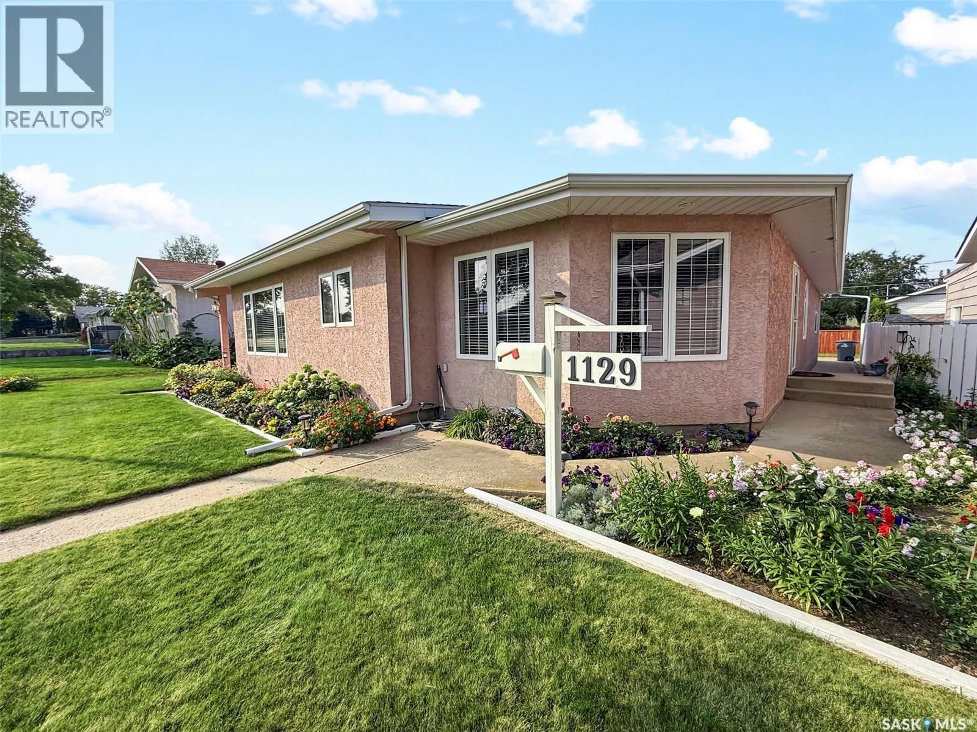 Home with brick exterior material, street for 1129 JUBILEE DRIVE, Swift Current Saskatchewan S9H2A1