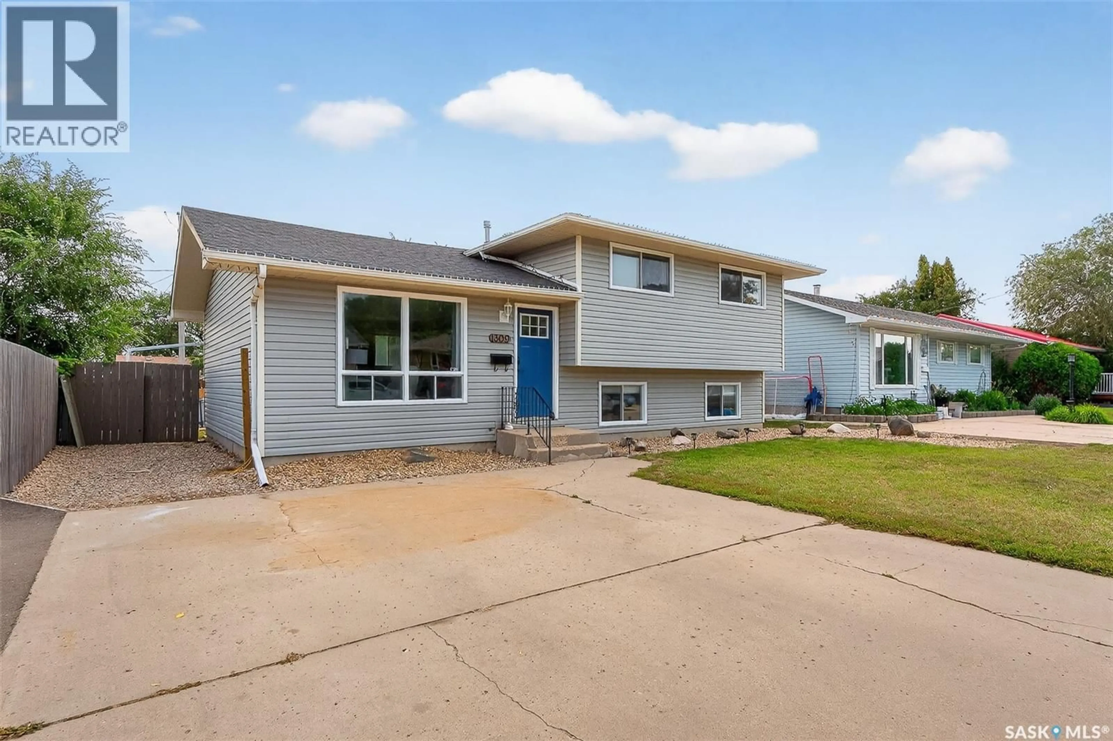 Home with vinyl exterior material, street for 1309 HOCHELAGA STREET, Moose Jaw Saskatchewan S6H6C3