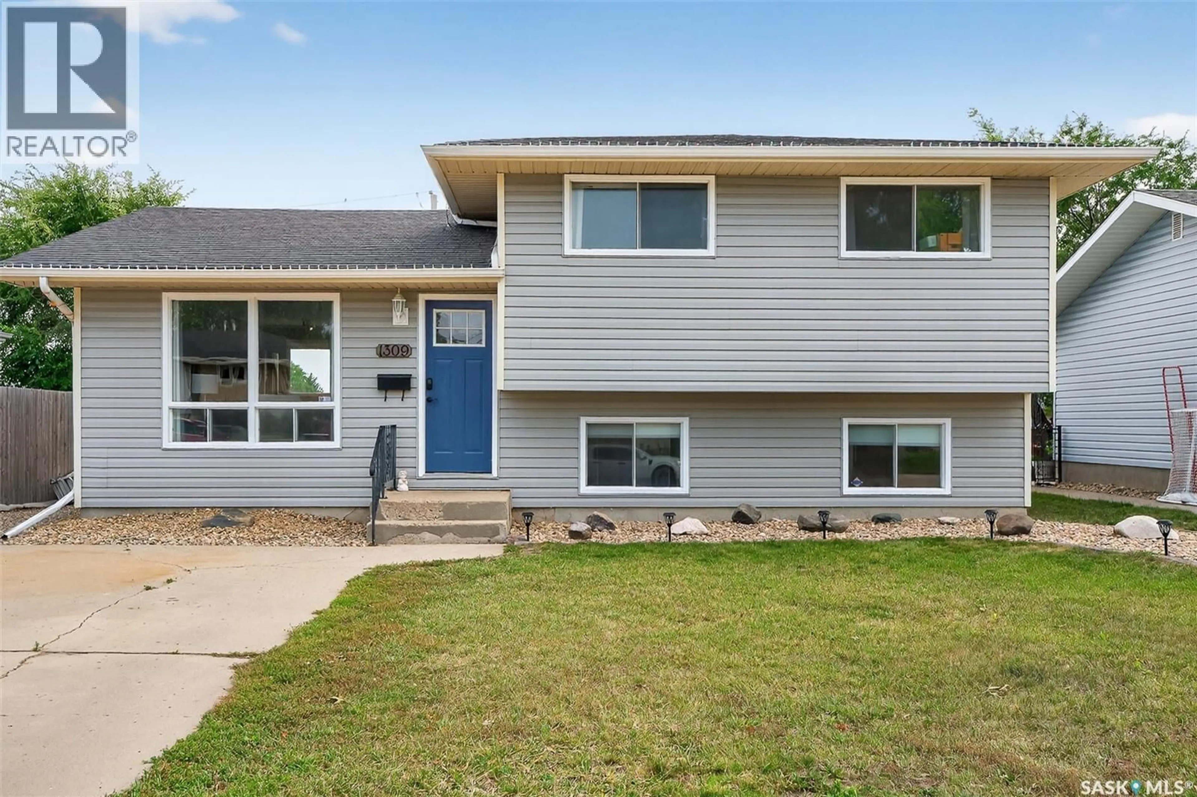 Home with vinyl exterior material, street for 1309 HOCHELAGA STREET, Moose Jaw Saskatchewan S6H6C3