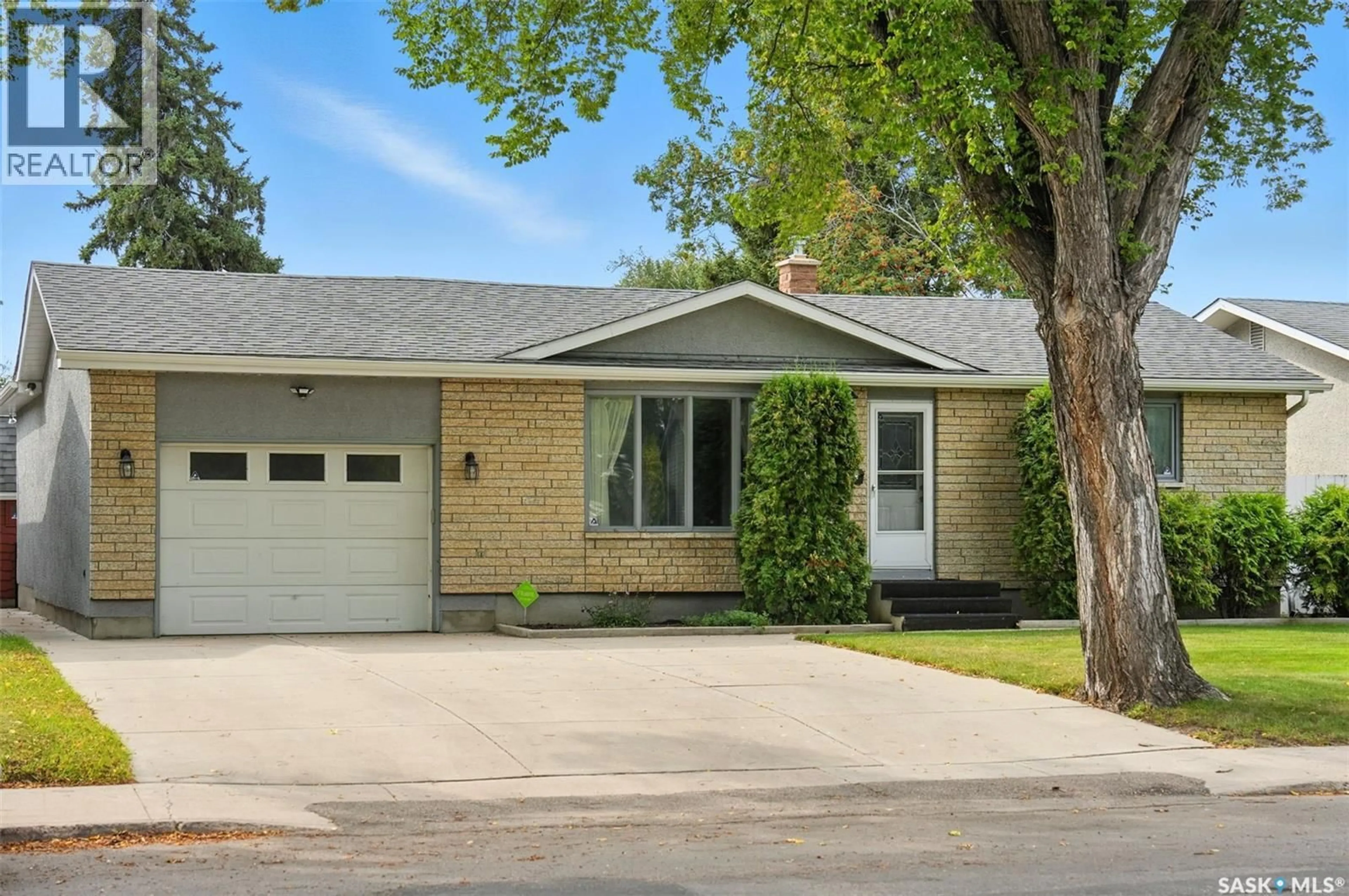 Home with vinyl exterior material, street for 2213 RICHARDSON ROAD, Saskatoon Saskatchewan S7L4B9