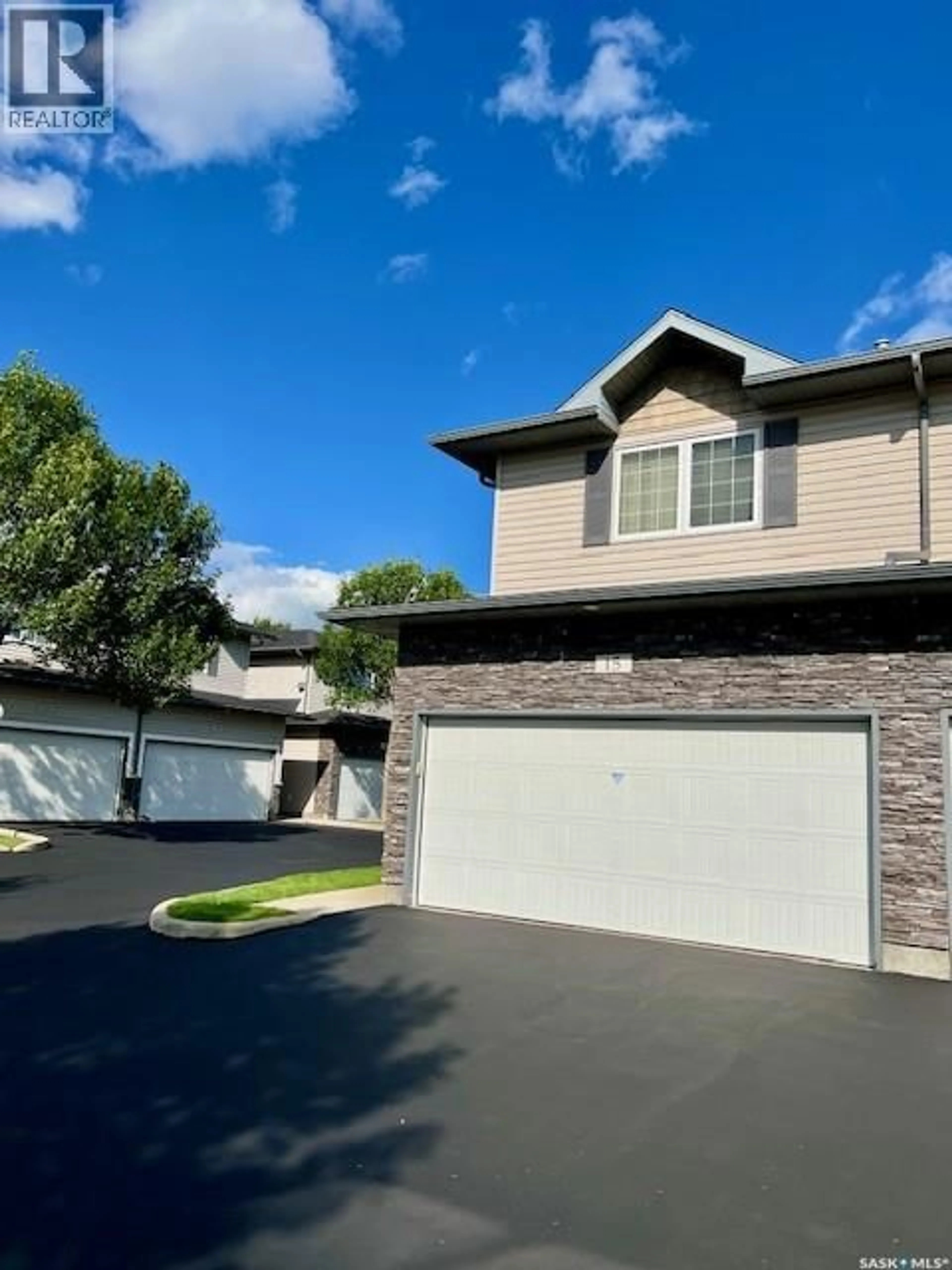 Home with vinyl exterior material, street for 15 110 DULMAGE CRESCENT, Saskatoon Saskatchewan S7T0C7