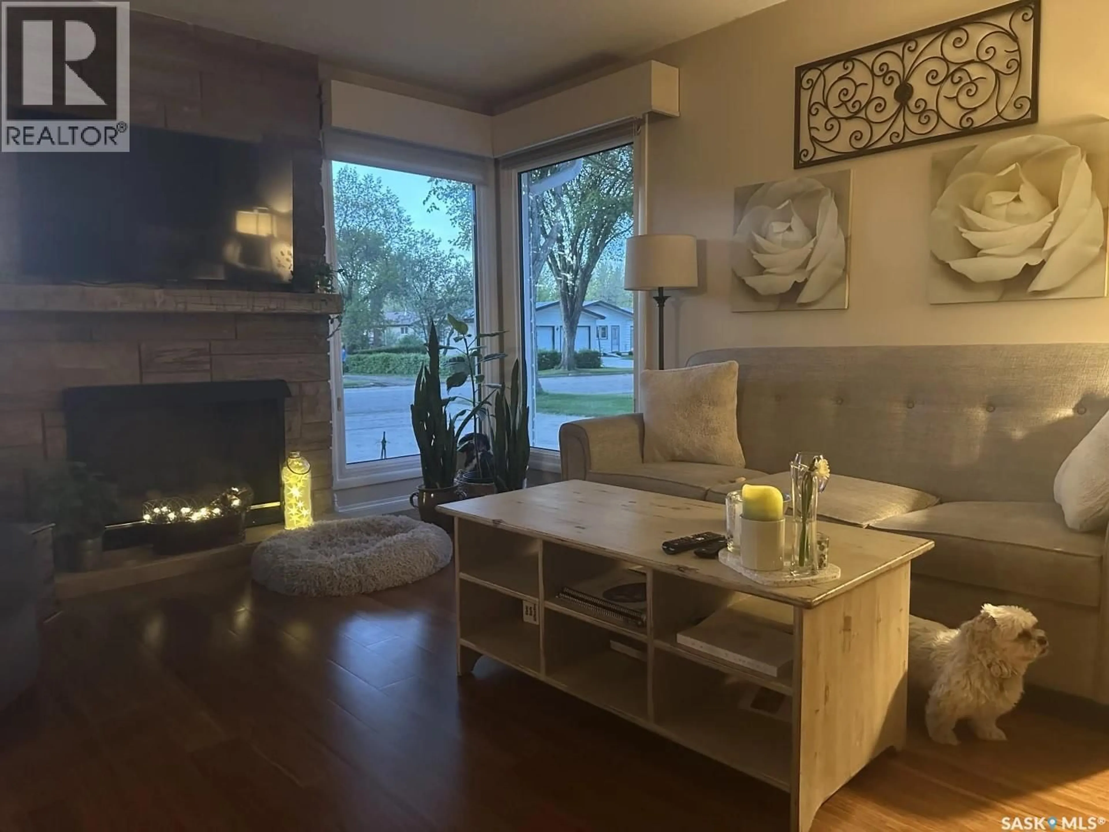 Living room with furniture, wood/laminate floor for 114 GARVIN CRESCENT, Canora Saskatchewan S0A0L0