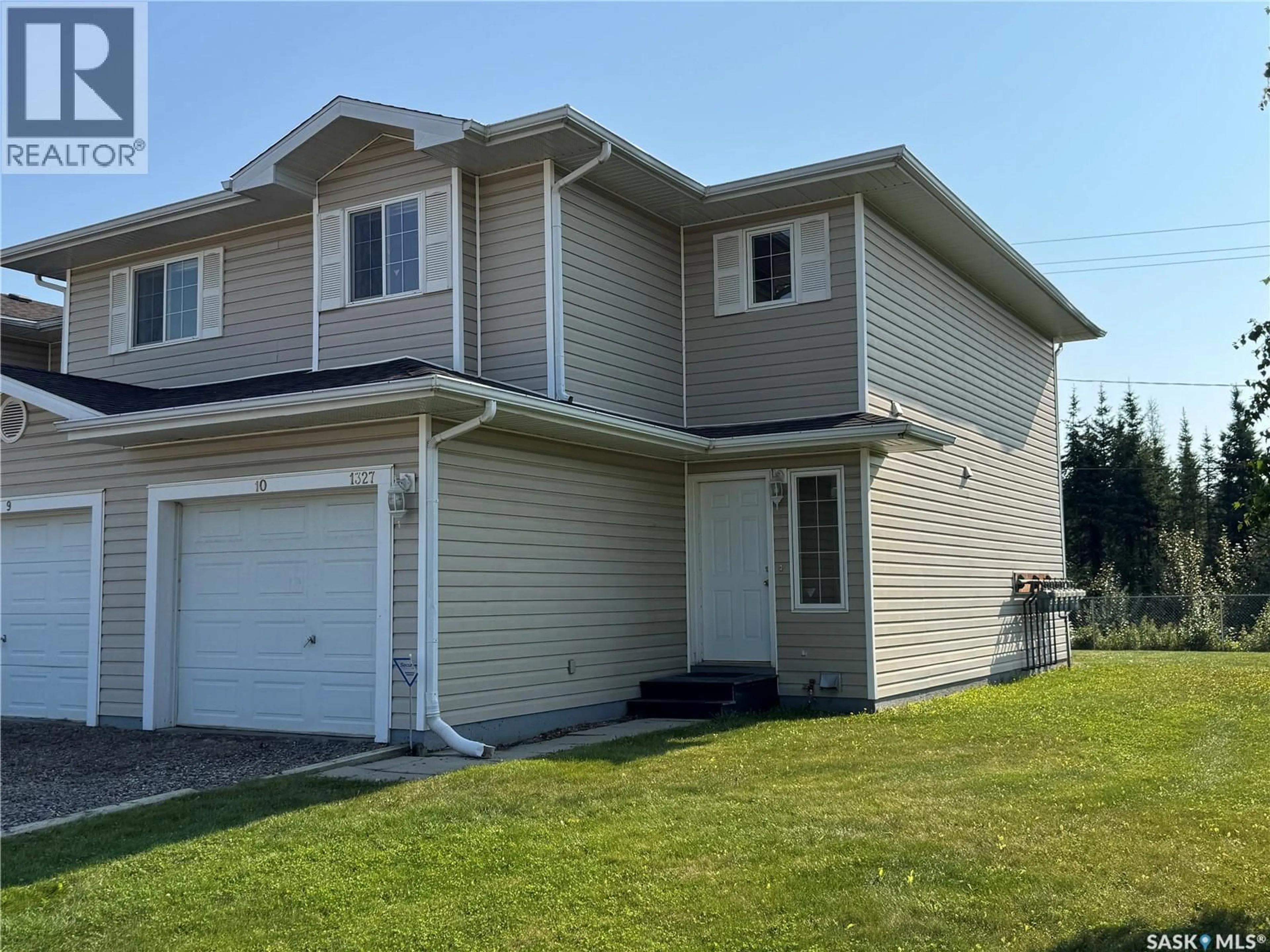 Home with vinyl exterior material, street for 10 1327 STUDER STREET, La Ronge Saskatchewan S0J1L0