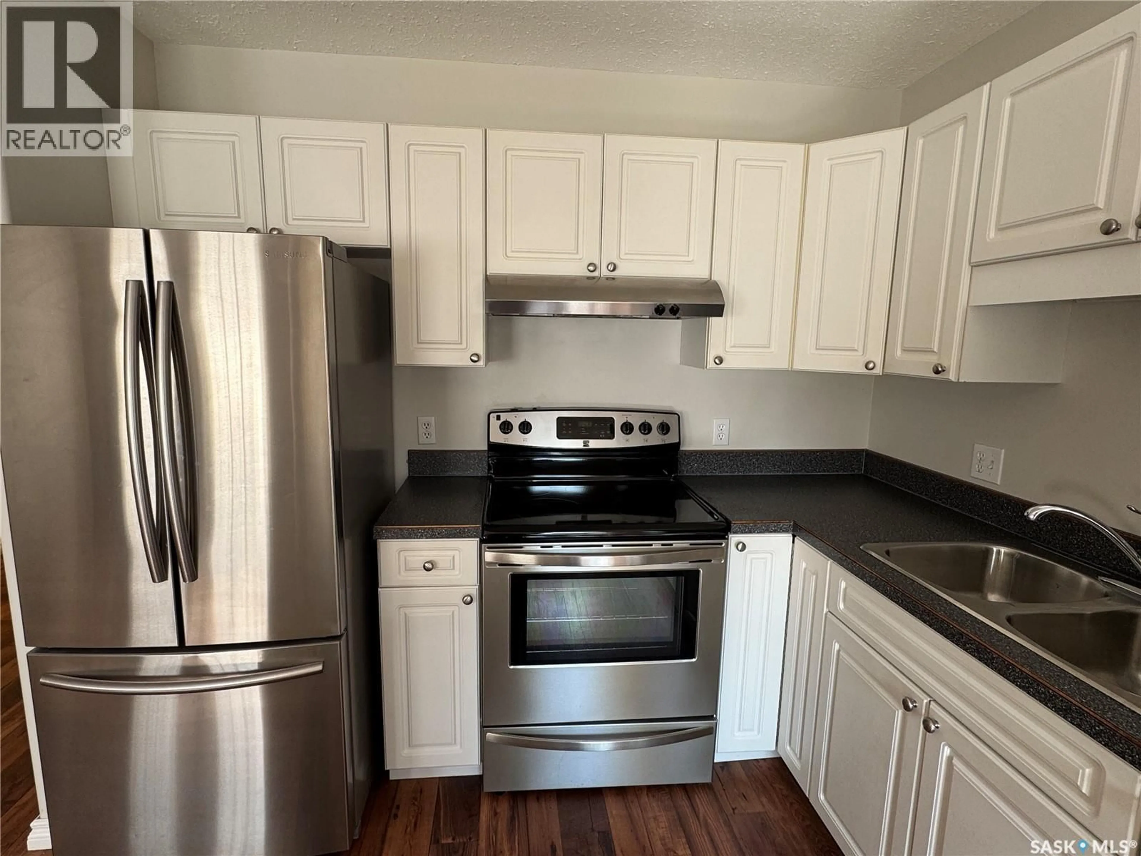 Standard kitchen, wood/laminate floor for 10 1327 STUDER STREET, La Ronge Saskatchewan S0J1L0