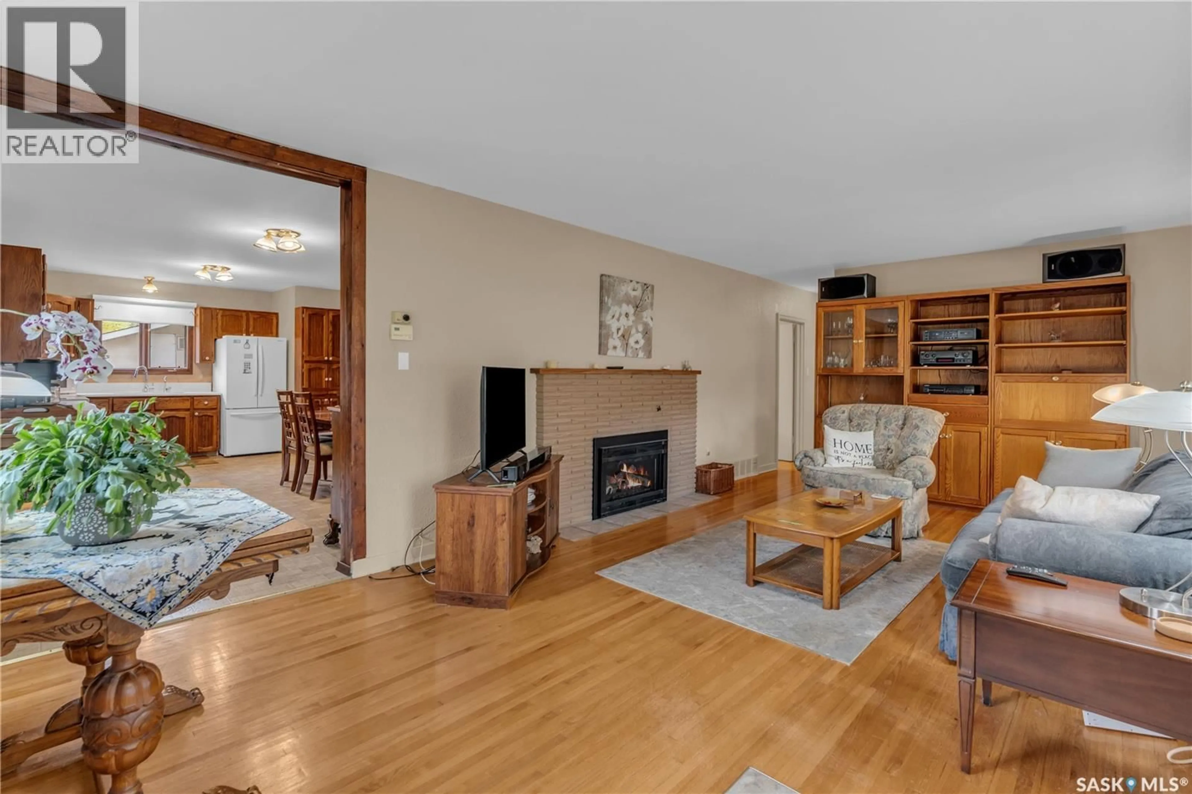 Living room with furniture, wood/laminate floor for 2813 23RD AVENUE, Regina Saskatchewan S4S1E7