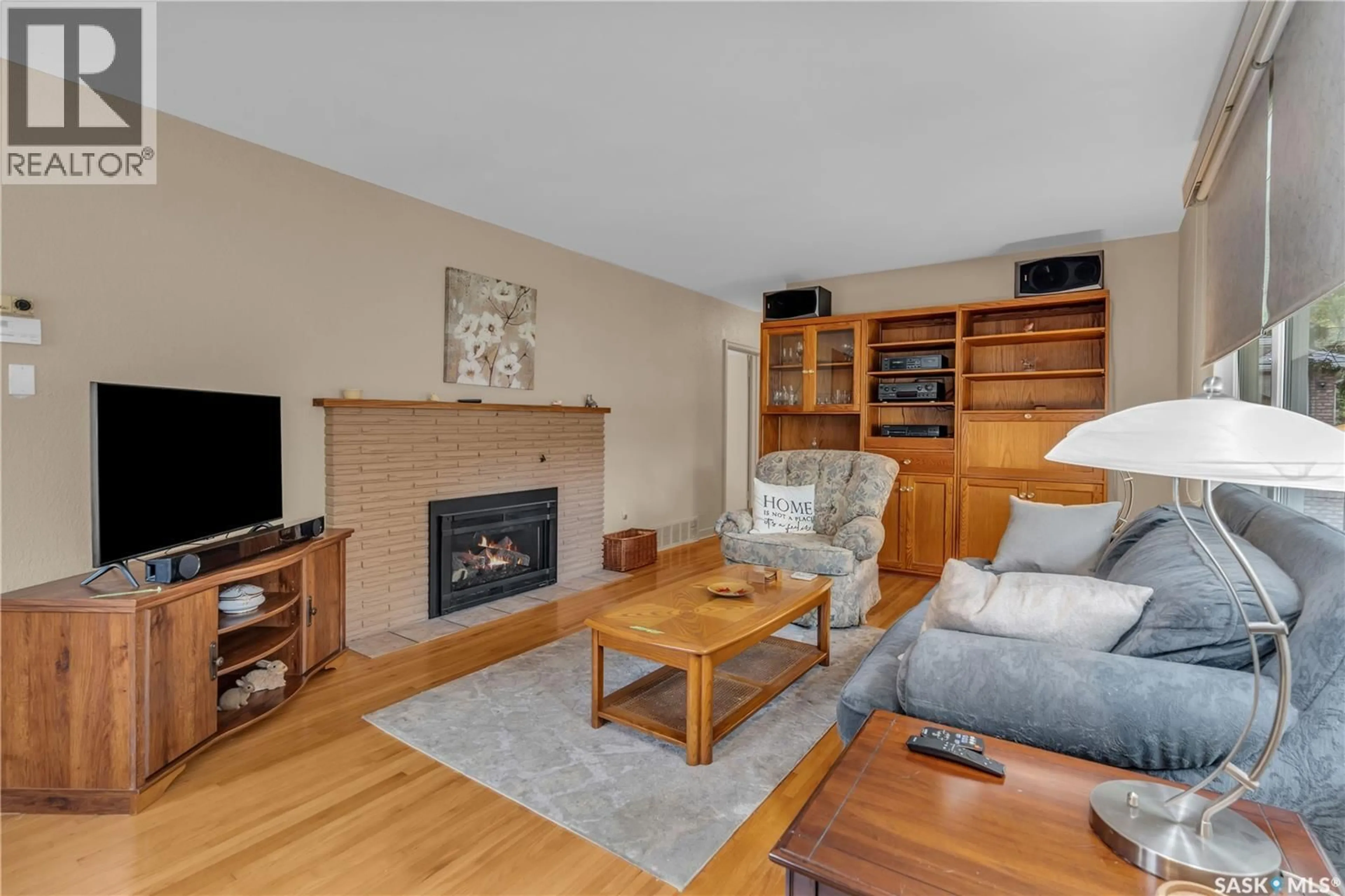 Living room with furniture, wood/laminate floor for 2813 23RD AVENUE, Regina Saskatchewan S4S1E7