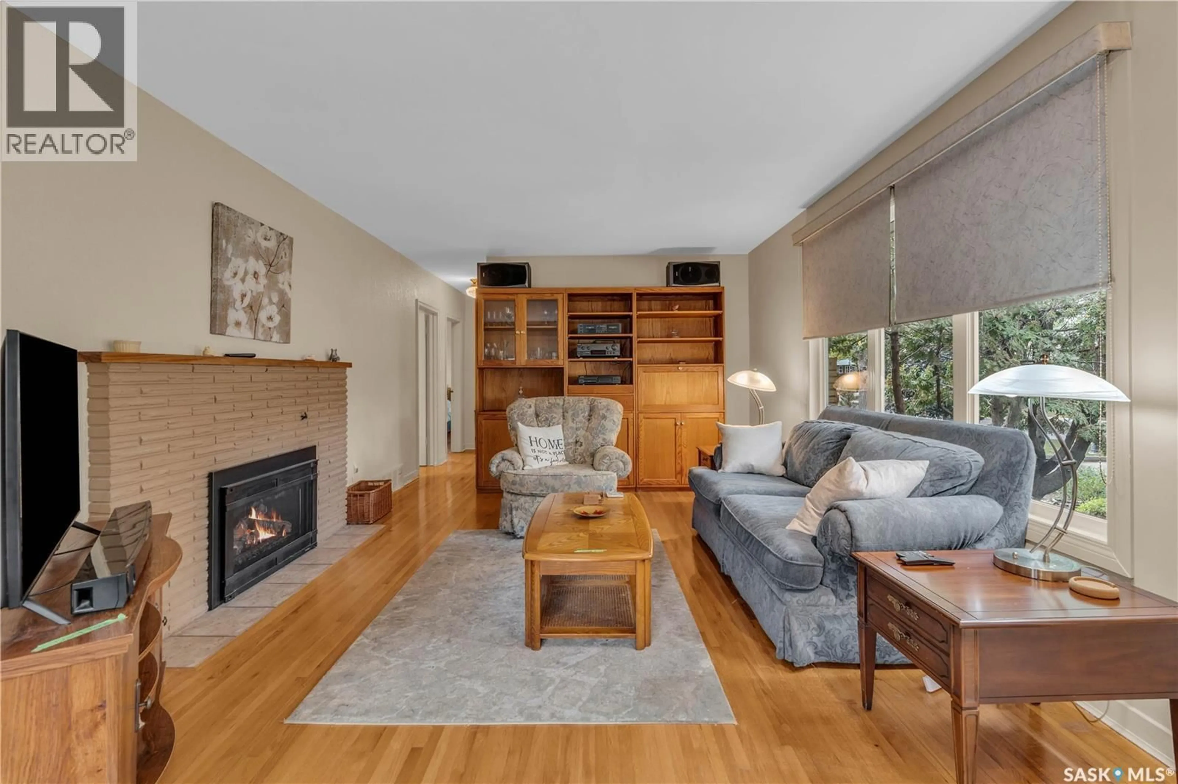 Living room with furniture, wood/laminate floor for 2813 23RD AVENUE, Regina Saskatchewan S4S1E7