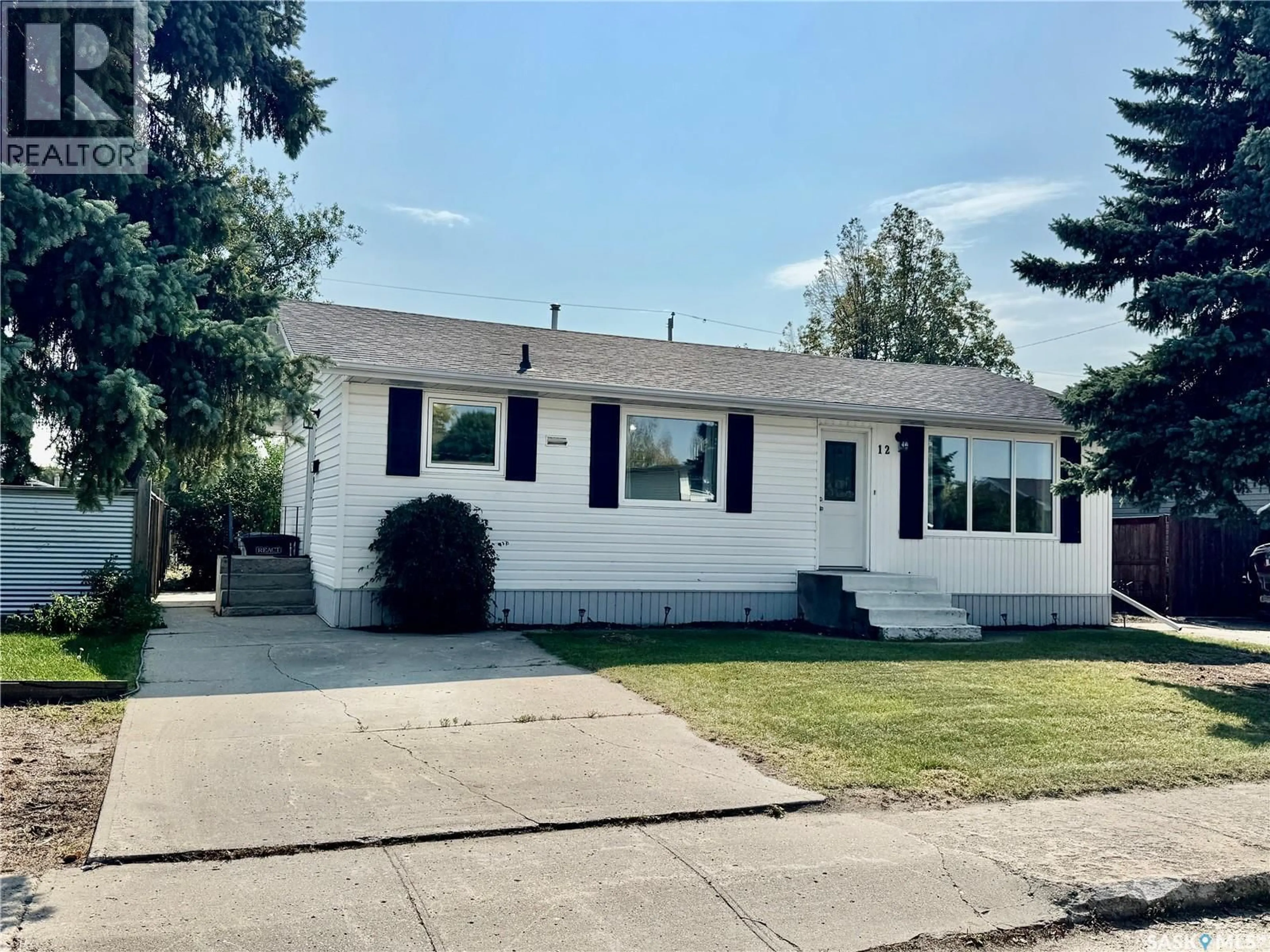 Home with vinyl exterior material, street for 12 KING CRESCENT, Humboldt Saskatchewan S0K2A0