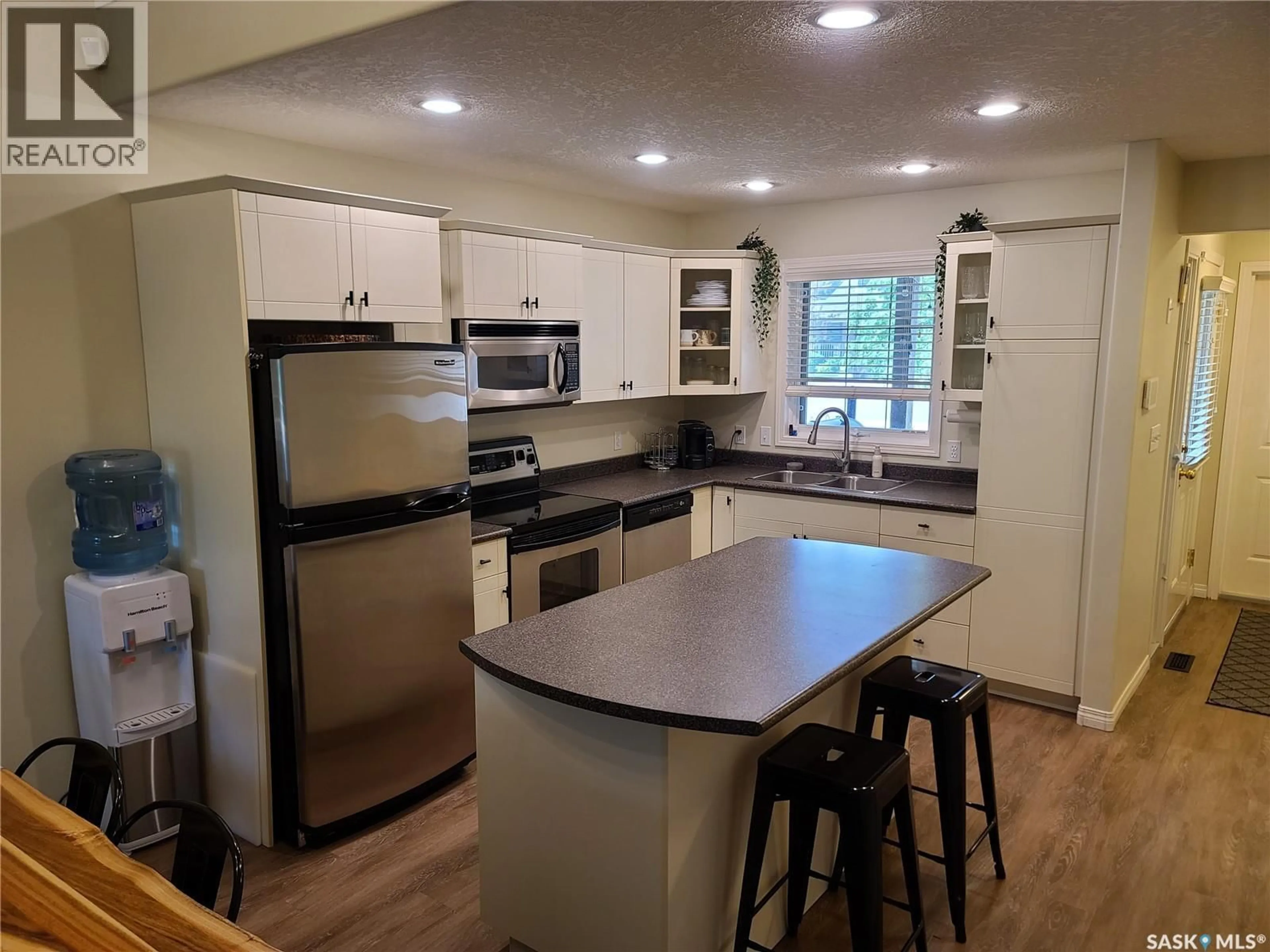 Open concept kitchen, wood/laminate floor for 6 EAGLE VIEW WAY, Elk Ridge Saskatchewan S0J0N0