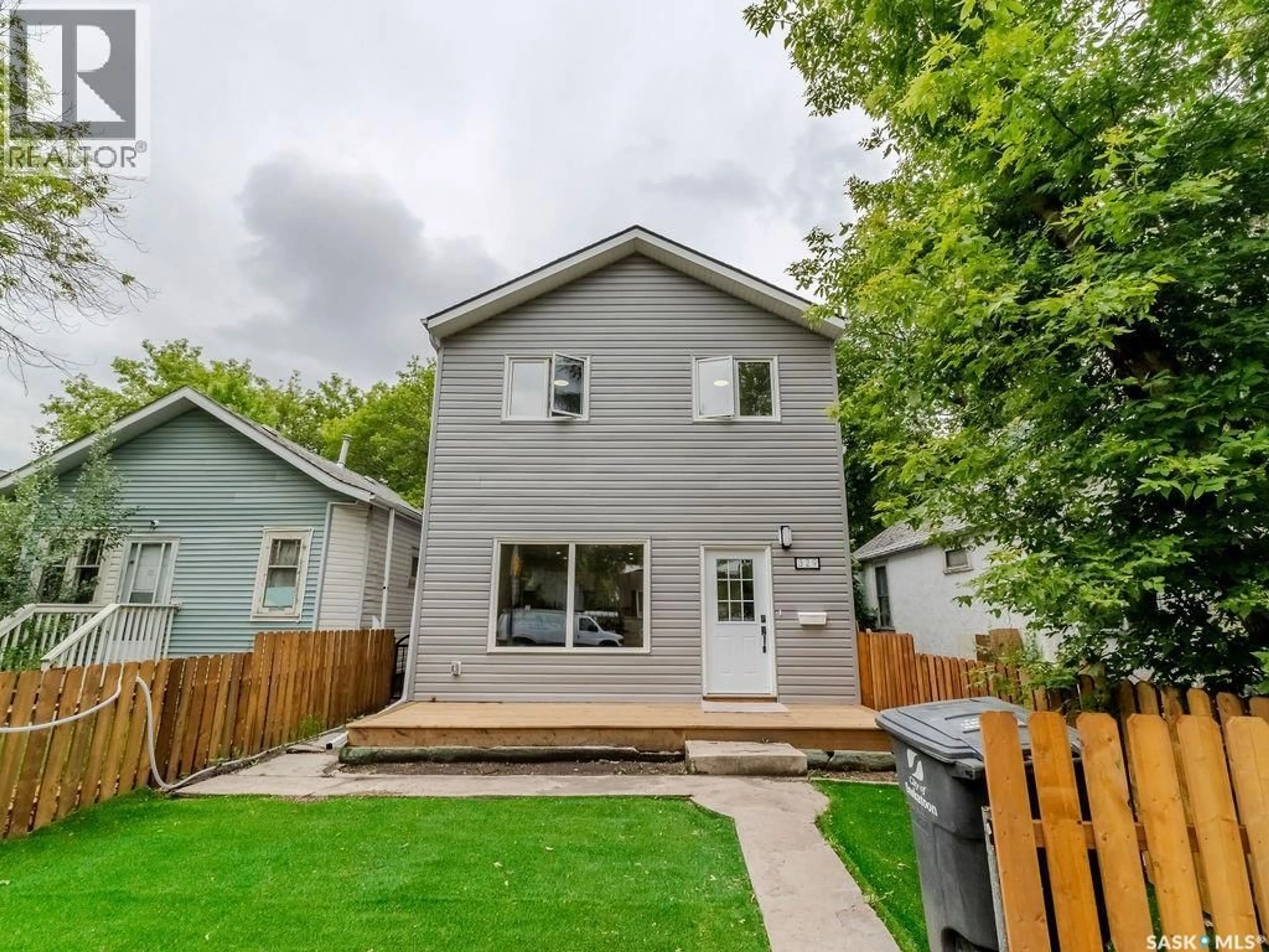 Home with vinyl exterior material, street for 329 J AVENUE, Saskatoon Saskatchewan S7M2A4