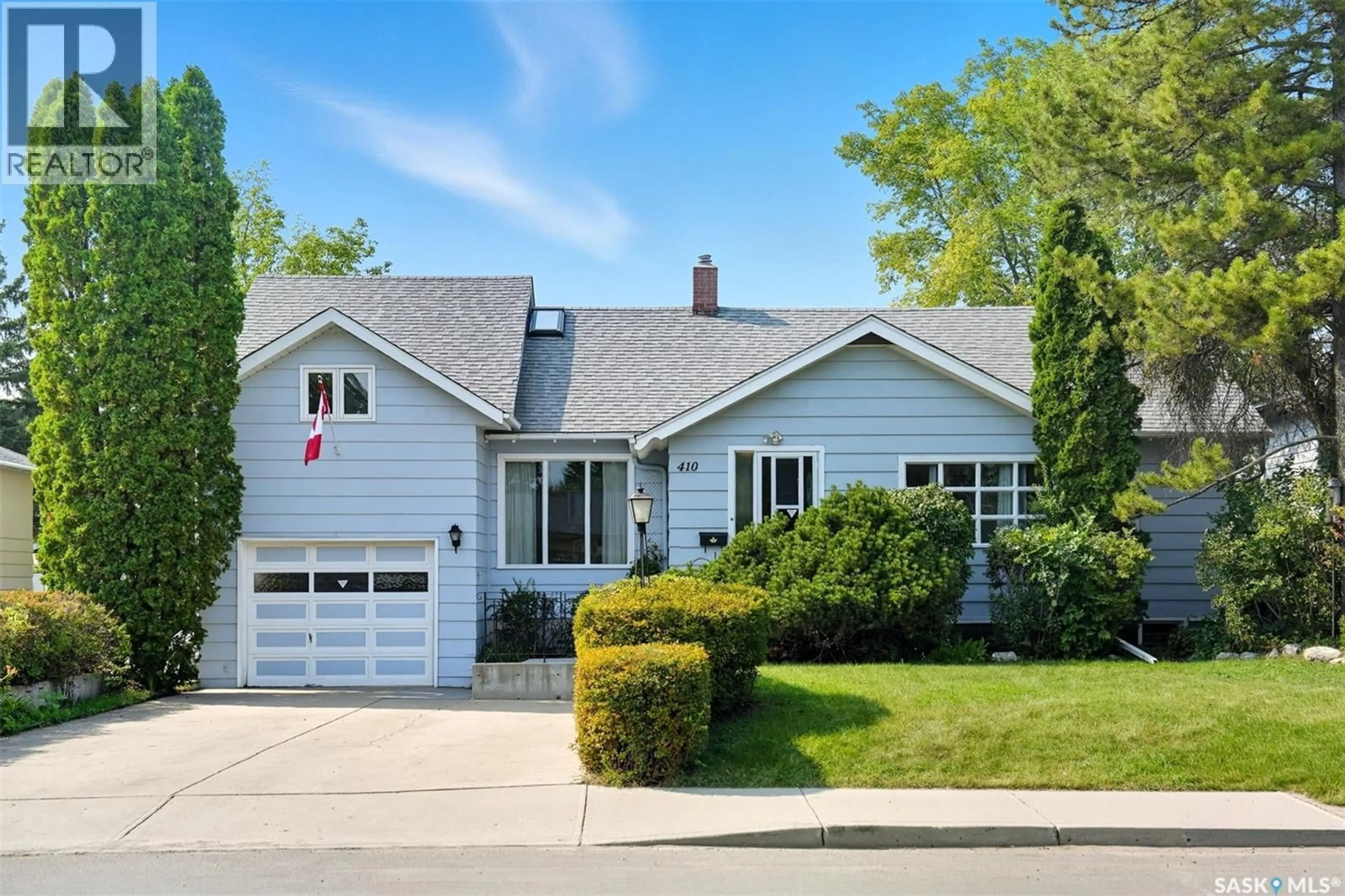 Home with vinyl exterior material, street for 410 LESLIE AVENUE, Saskatoon Saskatchewan S7H2Z1