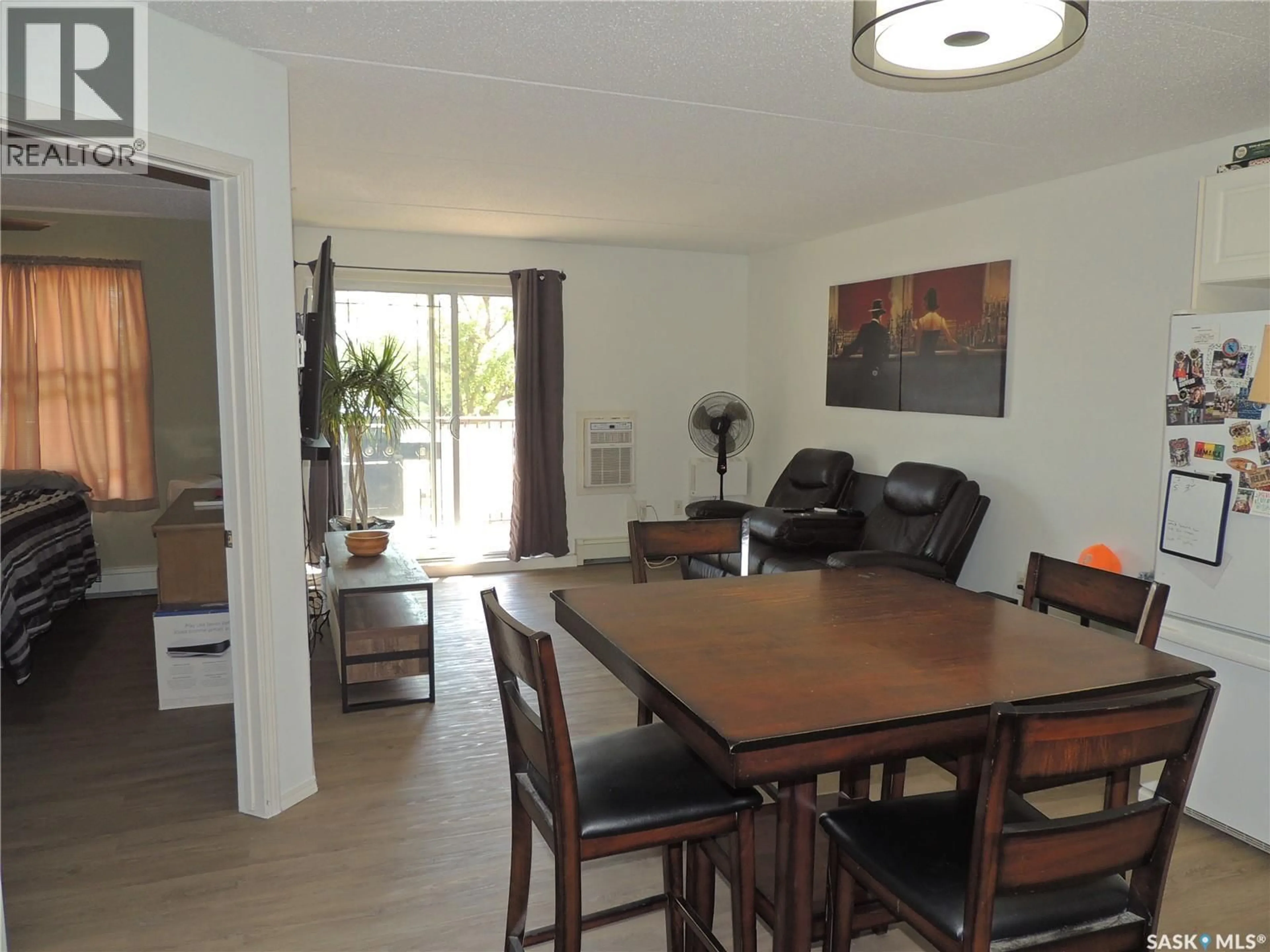 Dining room, wood/laminate floor for 701 - 201 HENRY STREET, Estevan Saskatchewan S4A2B7