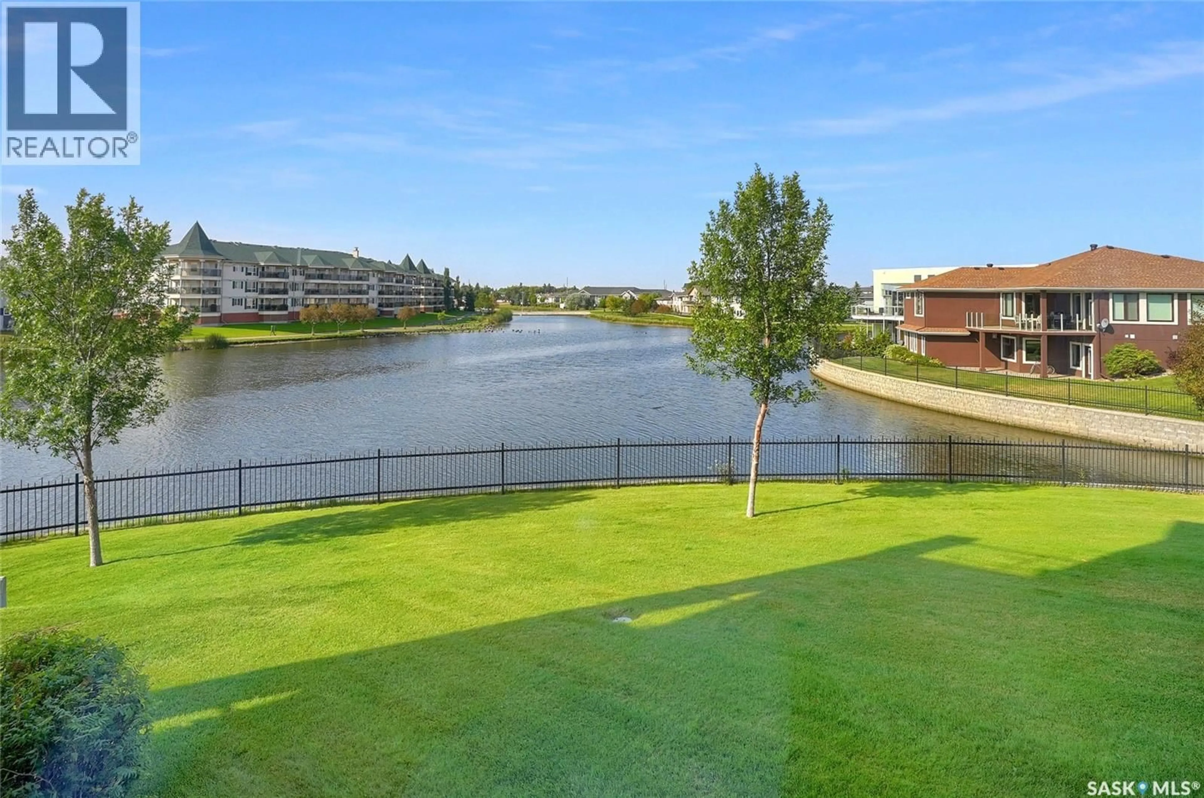 A pic from outside/outdoor area/front of a property/back of a property/a pic from drone, water/lake/river/ocean view for 106 2150 HESELTINE ROAD, Regina Saskatchewan S4V1L1
