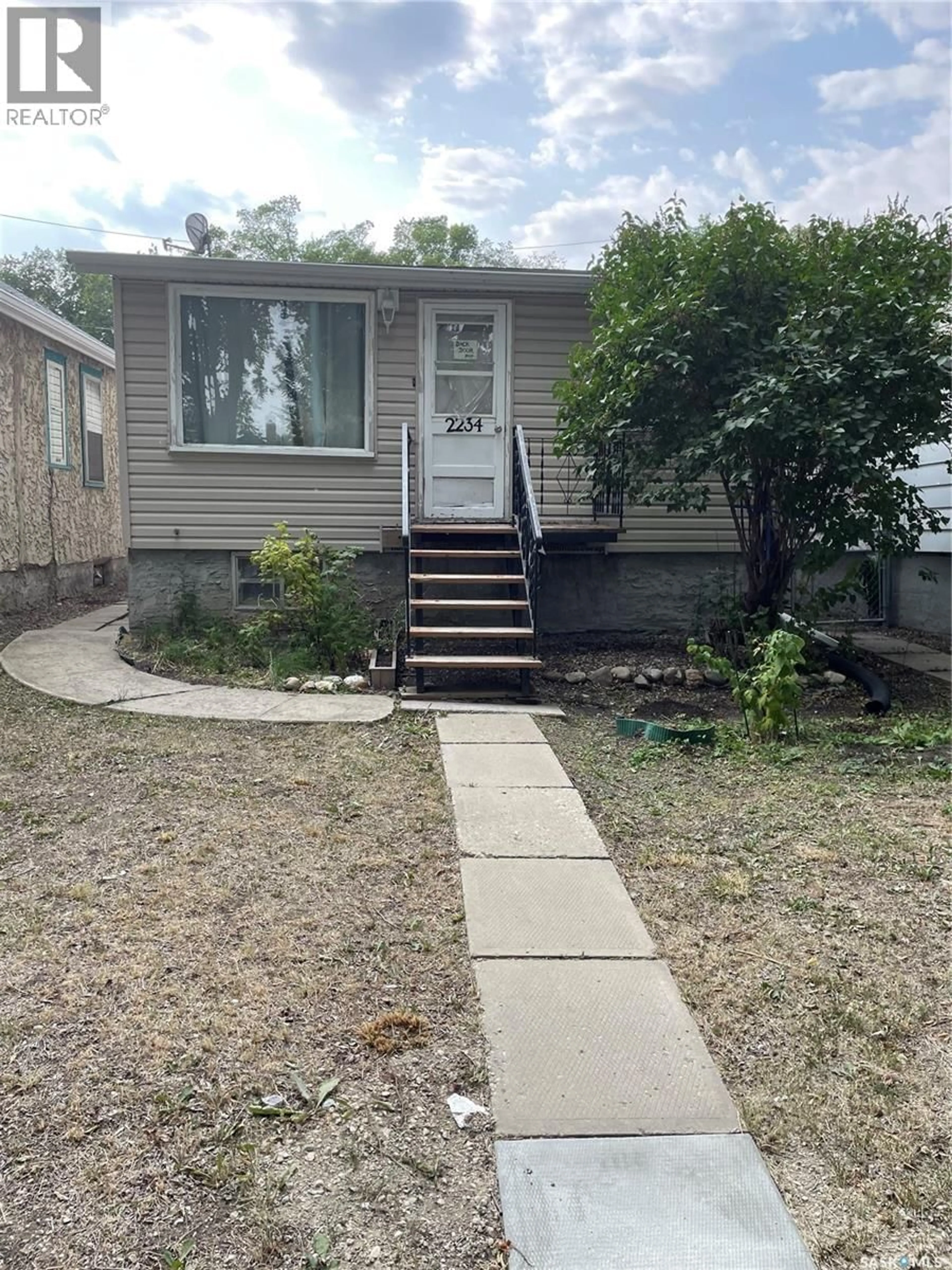 Home with vinyl exterior material, street for 2234 WINNIPEG STREET, Regina Saskatchewan S4P1H1