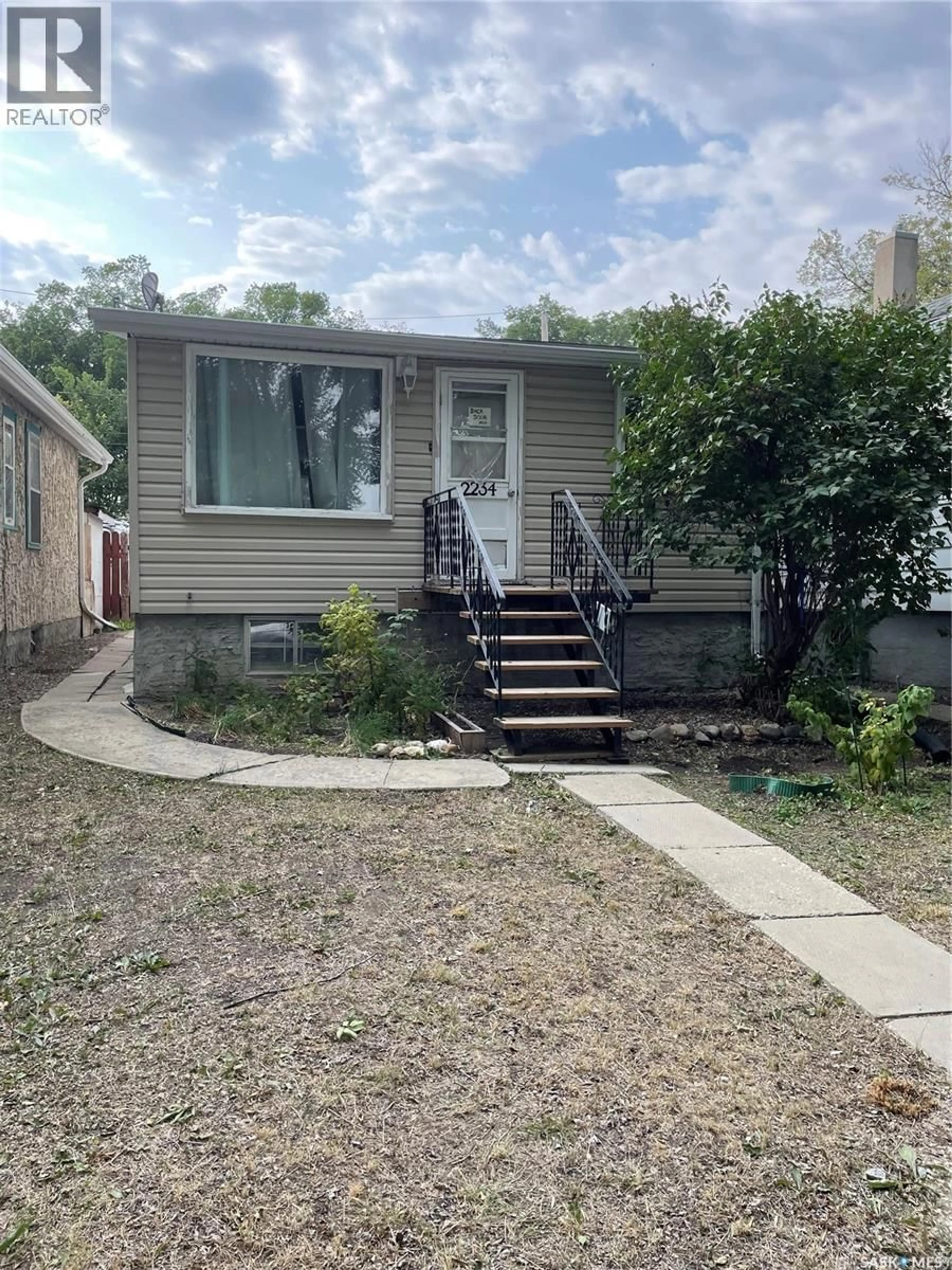 Home with vinyl exterior material, street for 2234 WINNIPEG STREET, Regina Saskatchewan S4P1H1