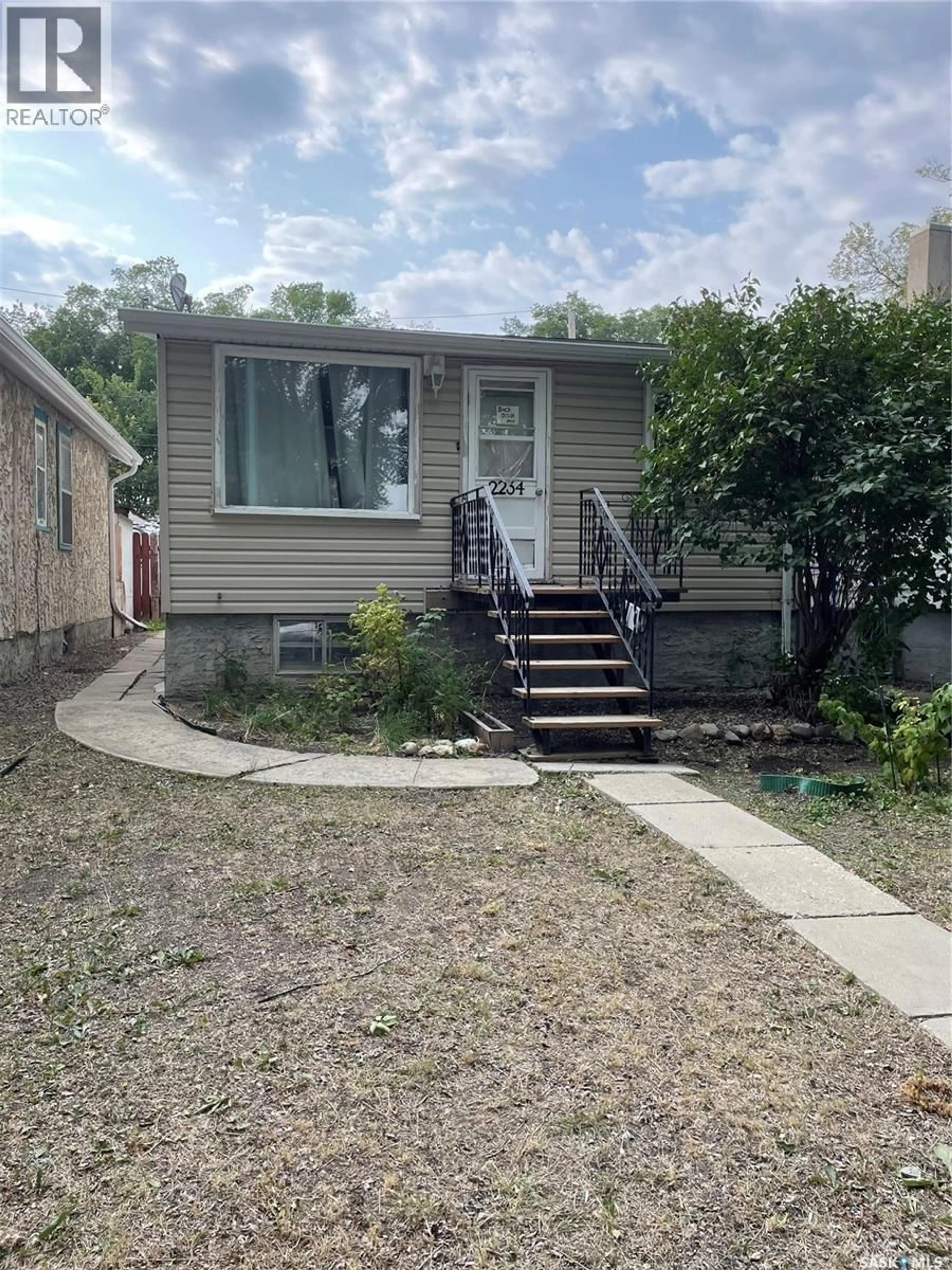 Home with vinyl exterior material, street for 2234 WINNIPEG STREET, Regina Saskatchewan S4P1H1