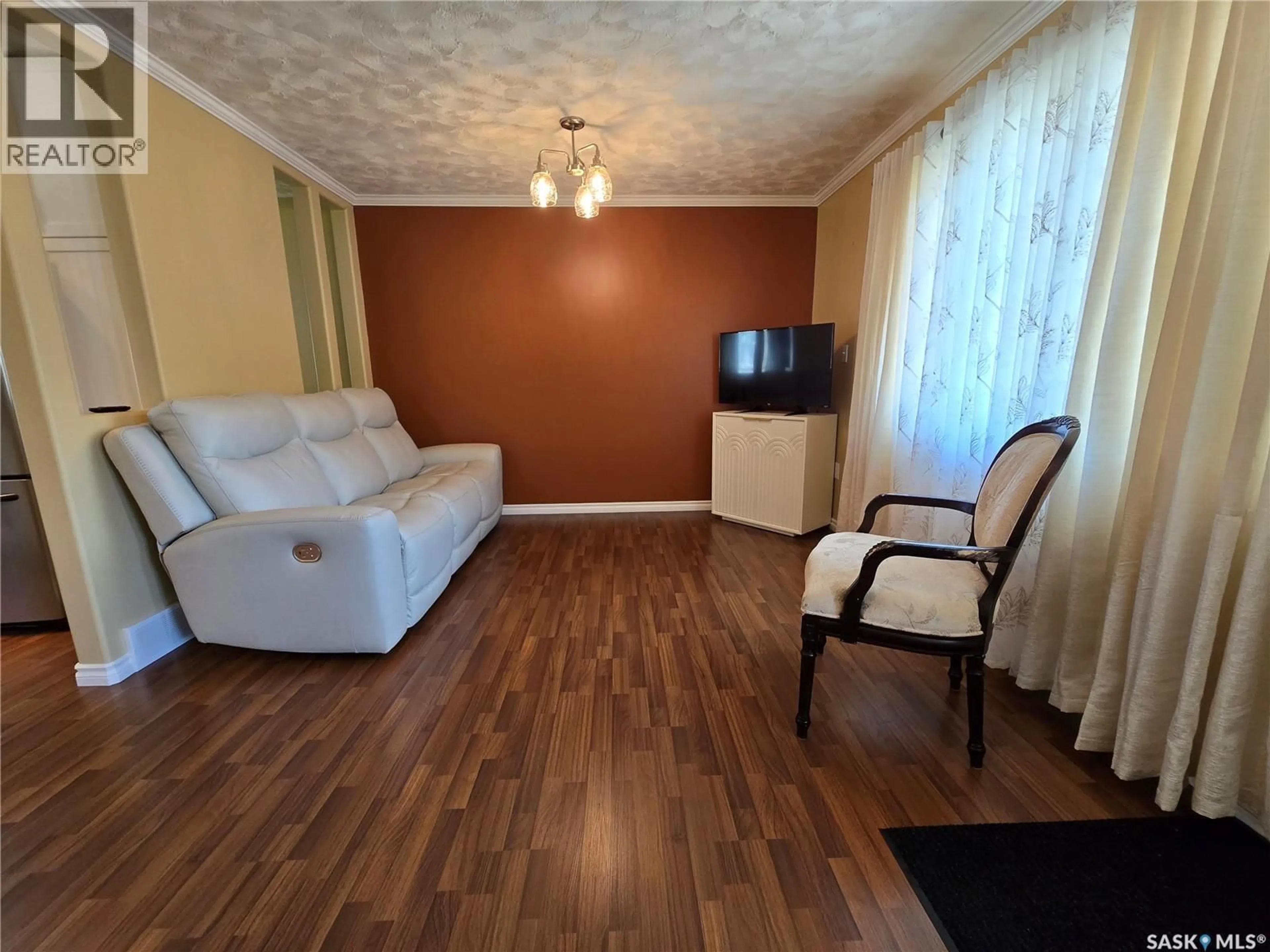 Living room with furniture, wood/laminate floor for 20 REDWOOD DRIVE, Yorkton Saskatchewan S3N2X7