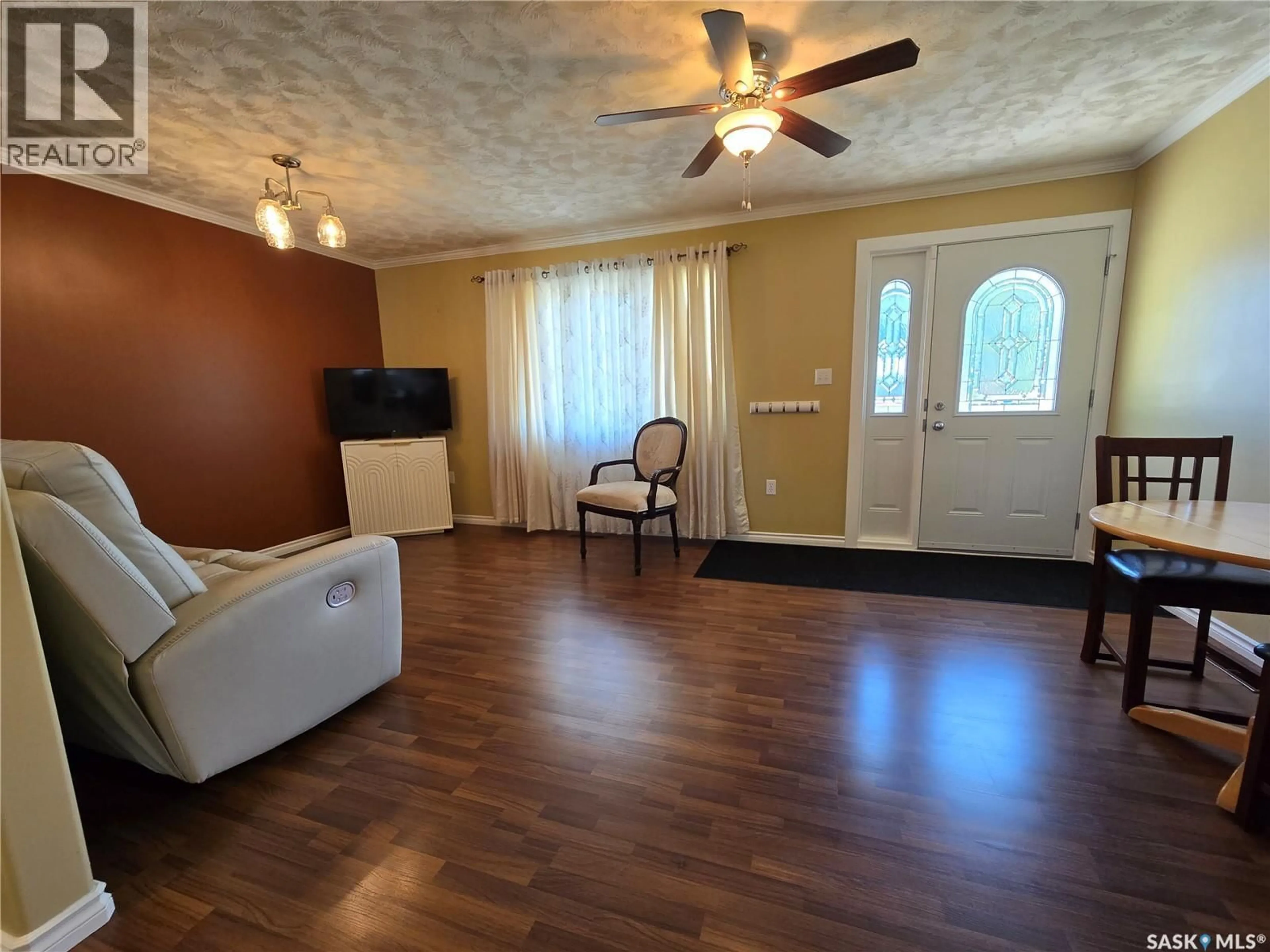 Living room with furniture, wood/laminate floor for 20 REDWOOD DRIVE, Yorkton Saskatchewan S3N2X7