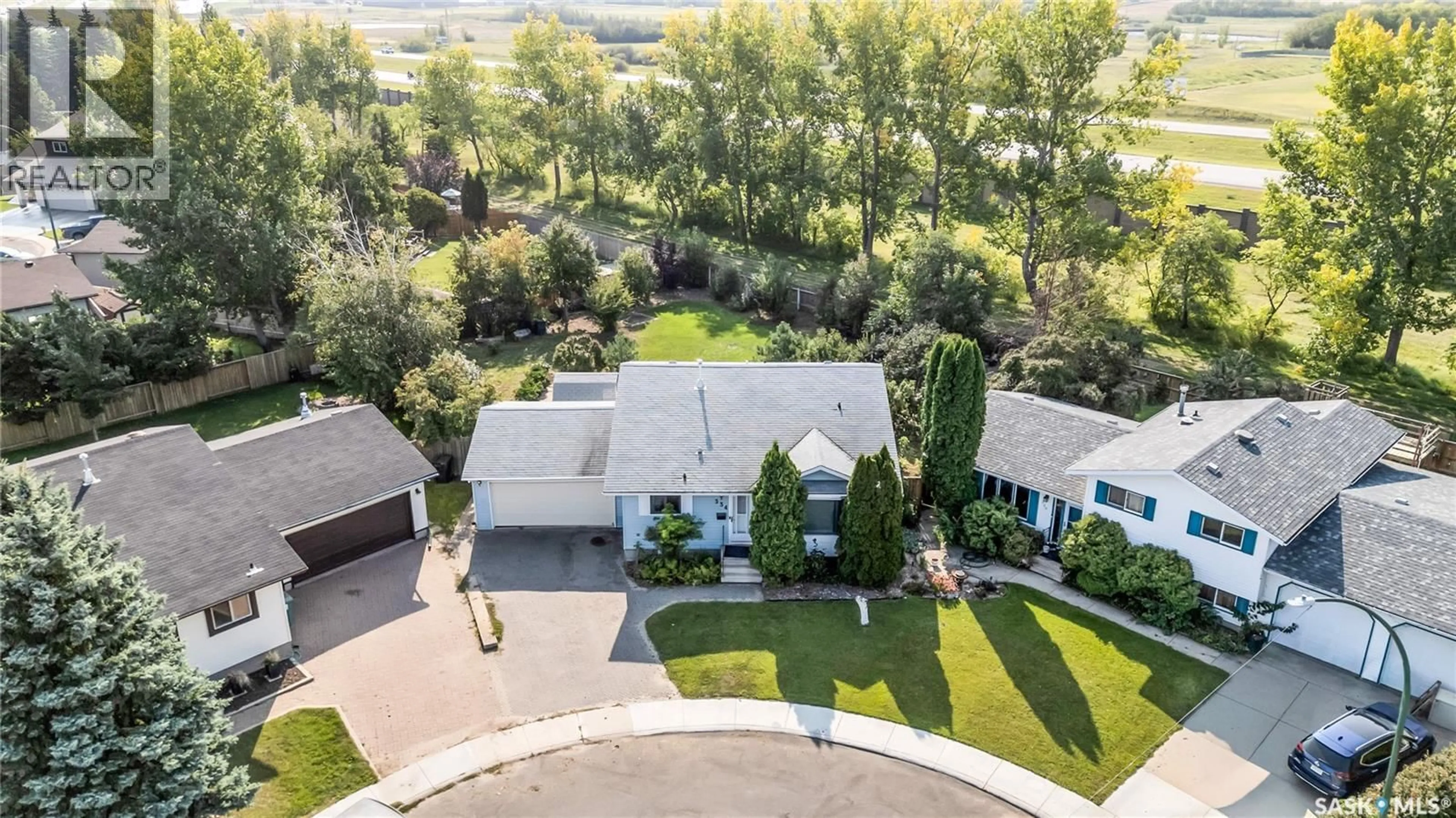 A pic from outside/outdoor area/front of a property/back of a property/a pic from drone, street for 334 WOLLASTON RISE, Saskatoon Saskatchewan S7J4M5