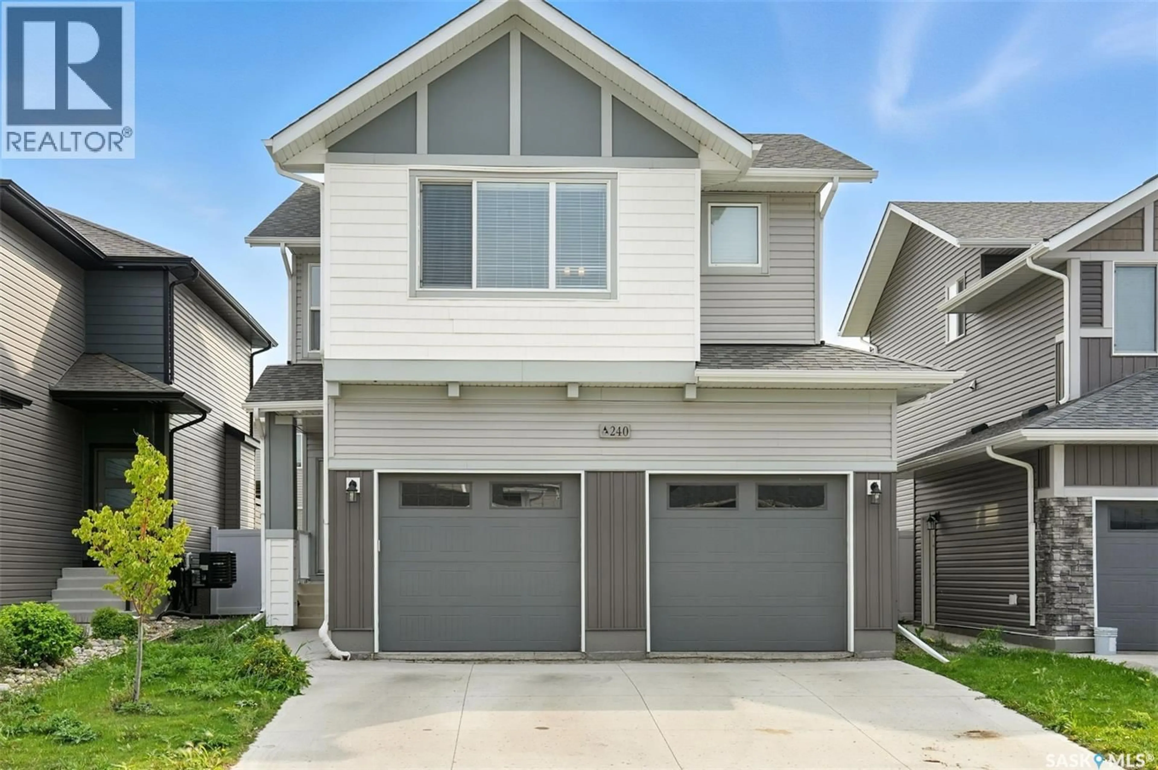 Home with vinyl exterior material, street for 240 BARRETT STREET, Saskatoon Saskatchewan S7W1C7