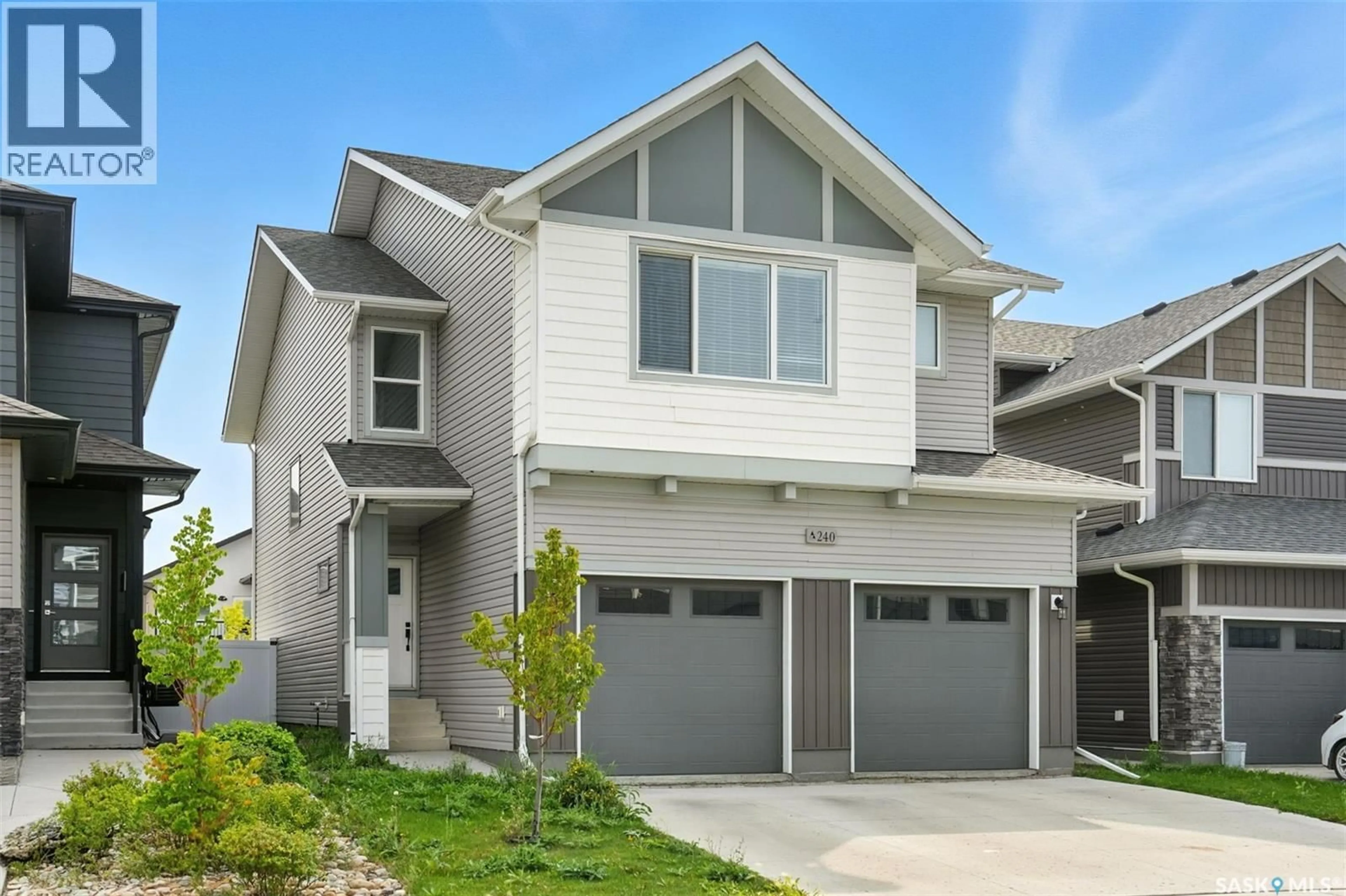 Home with vinyl exterior material, street for 240 BARRETT STREET, Saskatoon Saskatchewan S7W1C7