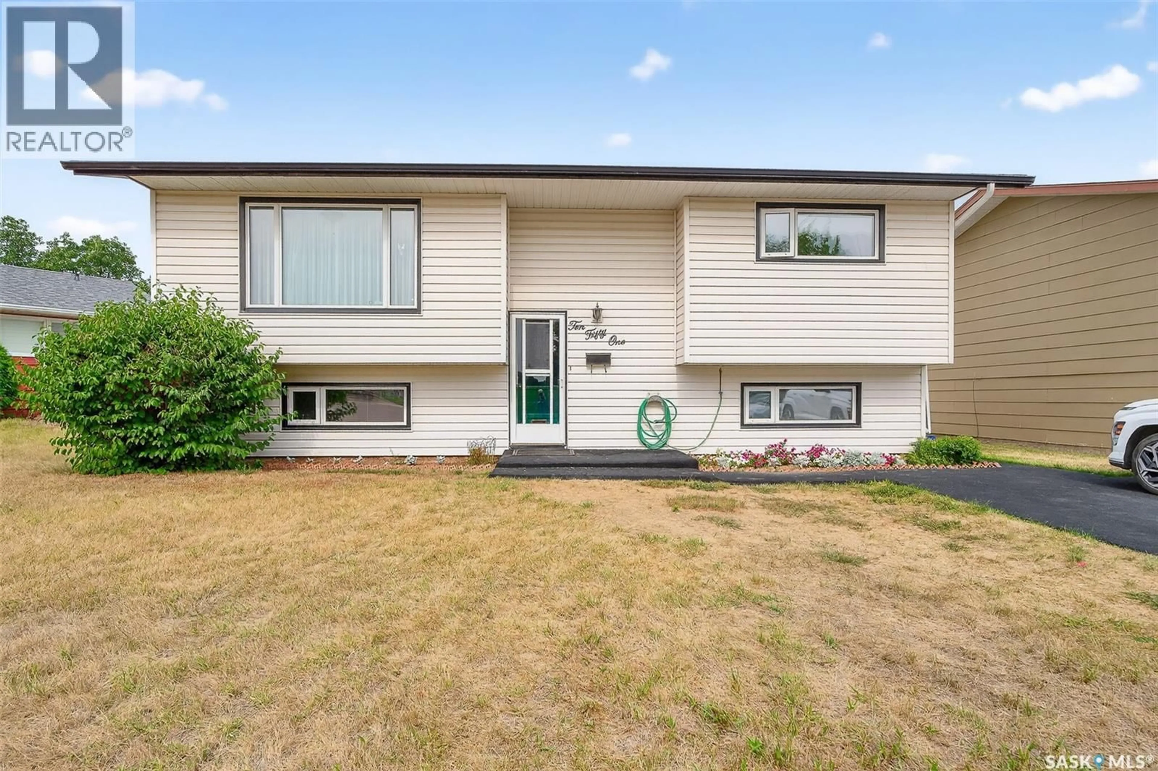 Home with vinyl exterior material, street for 1051 CORMAN CRESCENT, Moose Jaw Saskatchewan S6H6V5