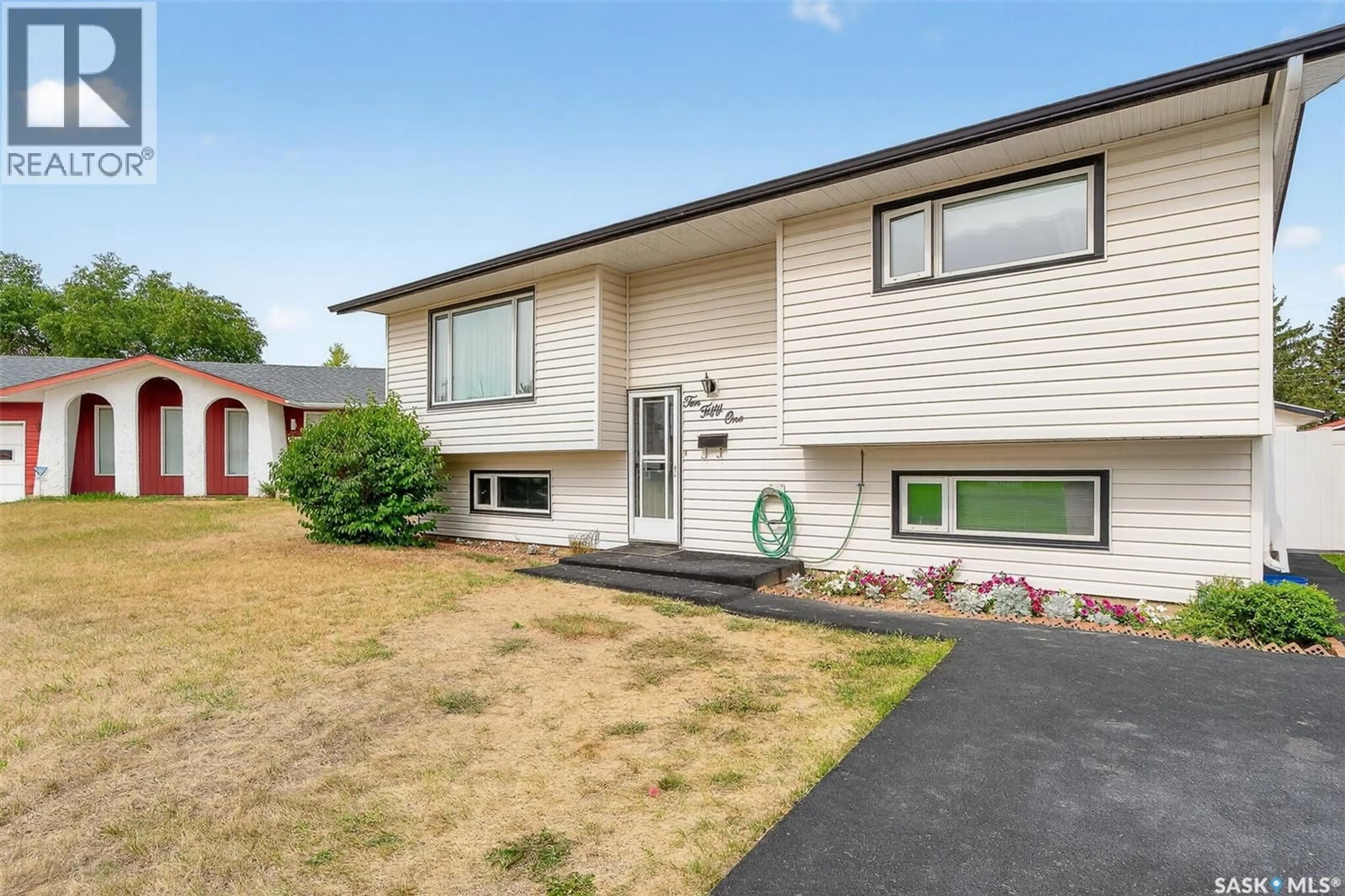 Home with vinyl exterior material, street for 1051 CORMAN CRESCENT, Moose Jaw Saskatchewan S6H6V5
