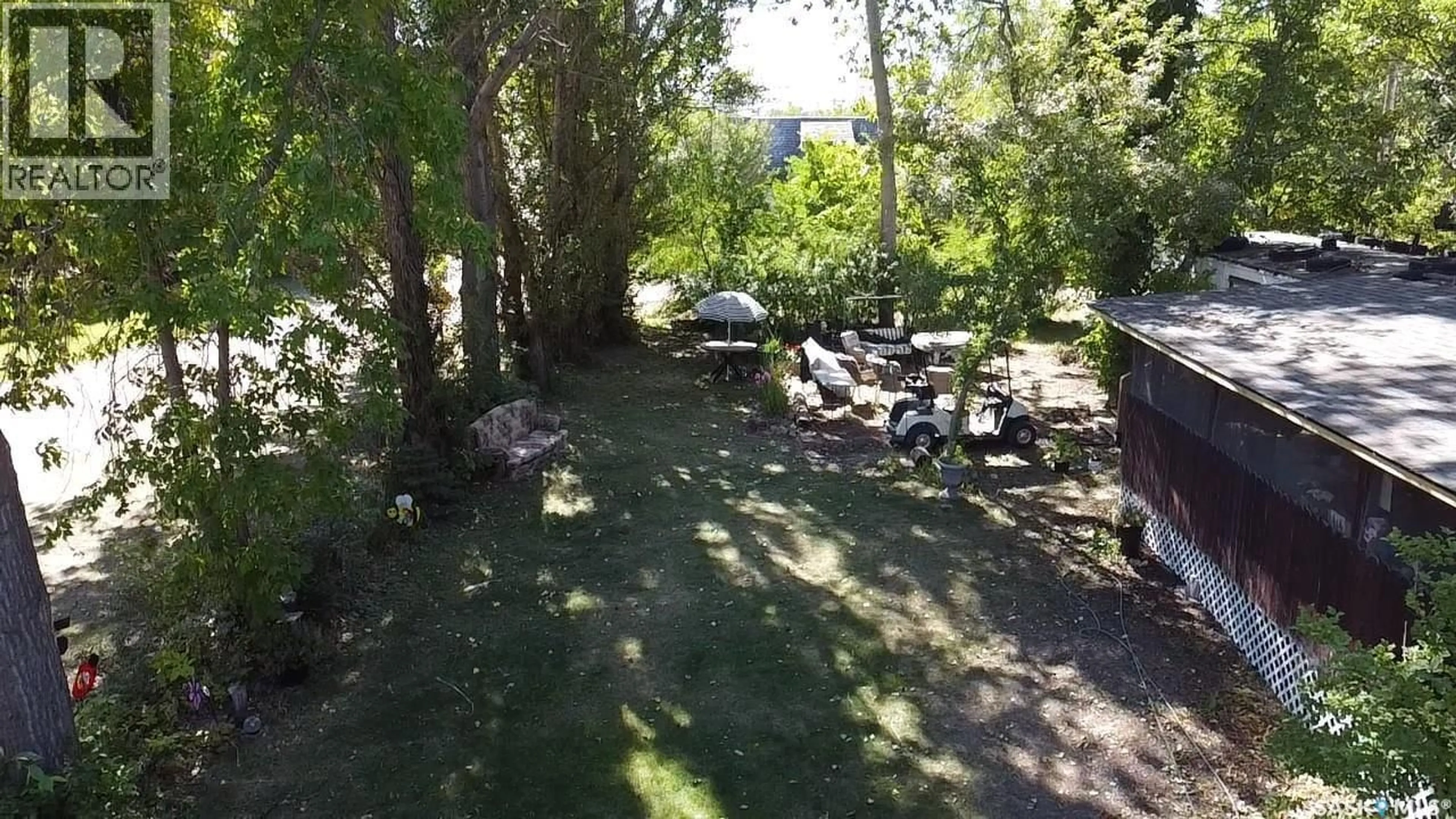 A pic from outside/outdoor area/front of a property/back of a property/a pic from drone, forest/trees view for 414 ZEALANDIA AVENUE, Coteau Beach Saskatchewan S0L0G0