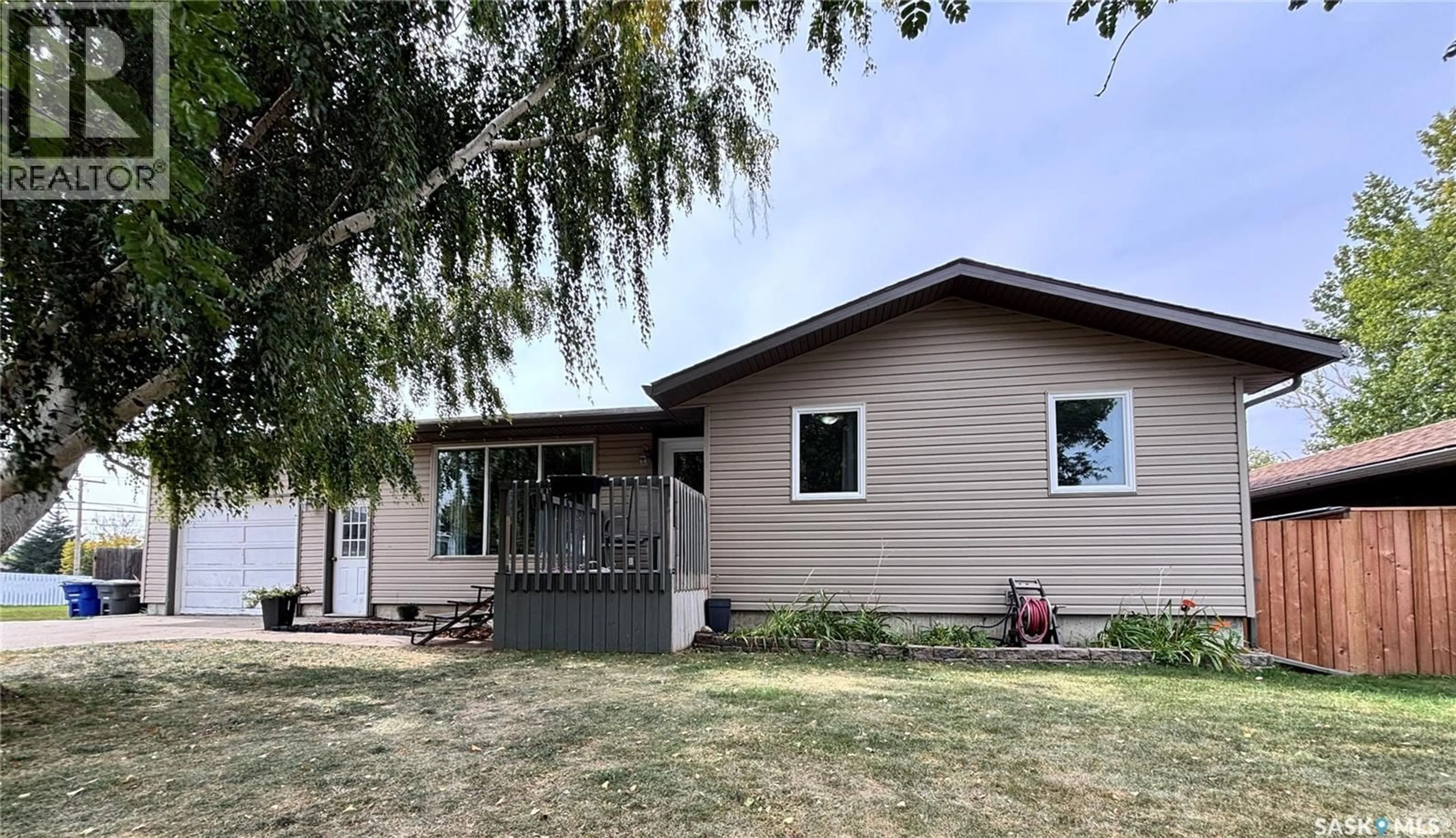 Home with vinyl exterior material, street for 302 ASH STREET, Outlook Saskatchewan S0L2N0