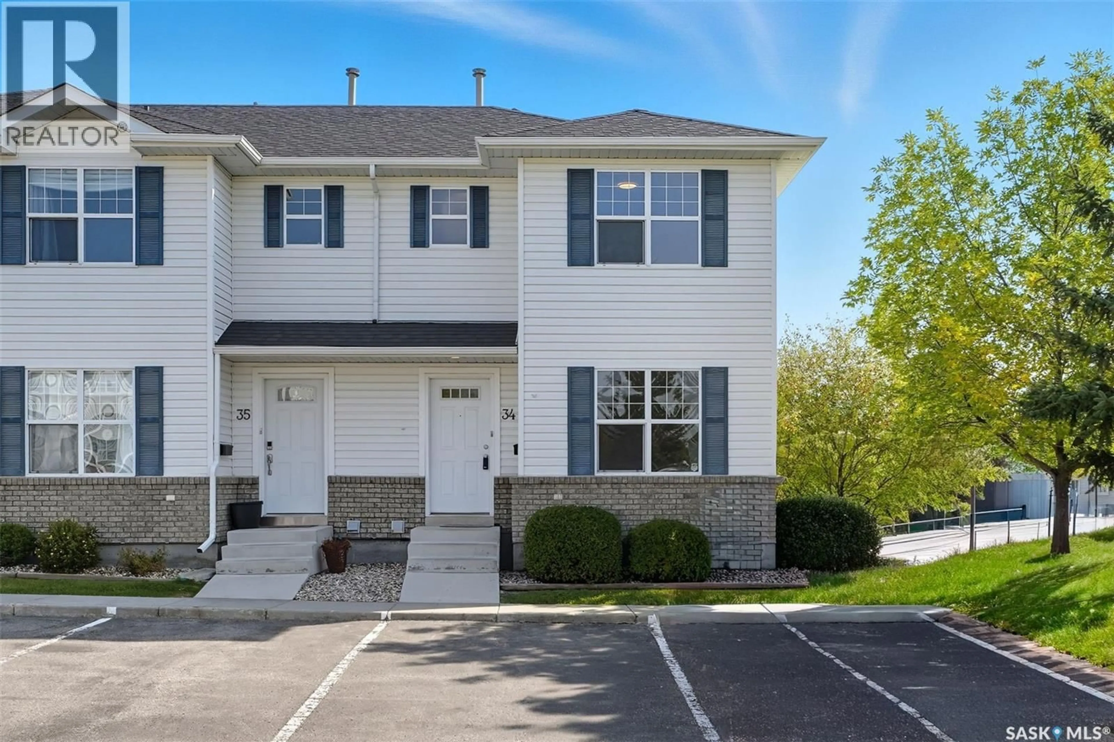 Home with vinyl exterior material, street for 34 203 HEROLD TERRACE, Saskatoon Saskatchewan S7V1H3
