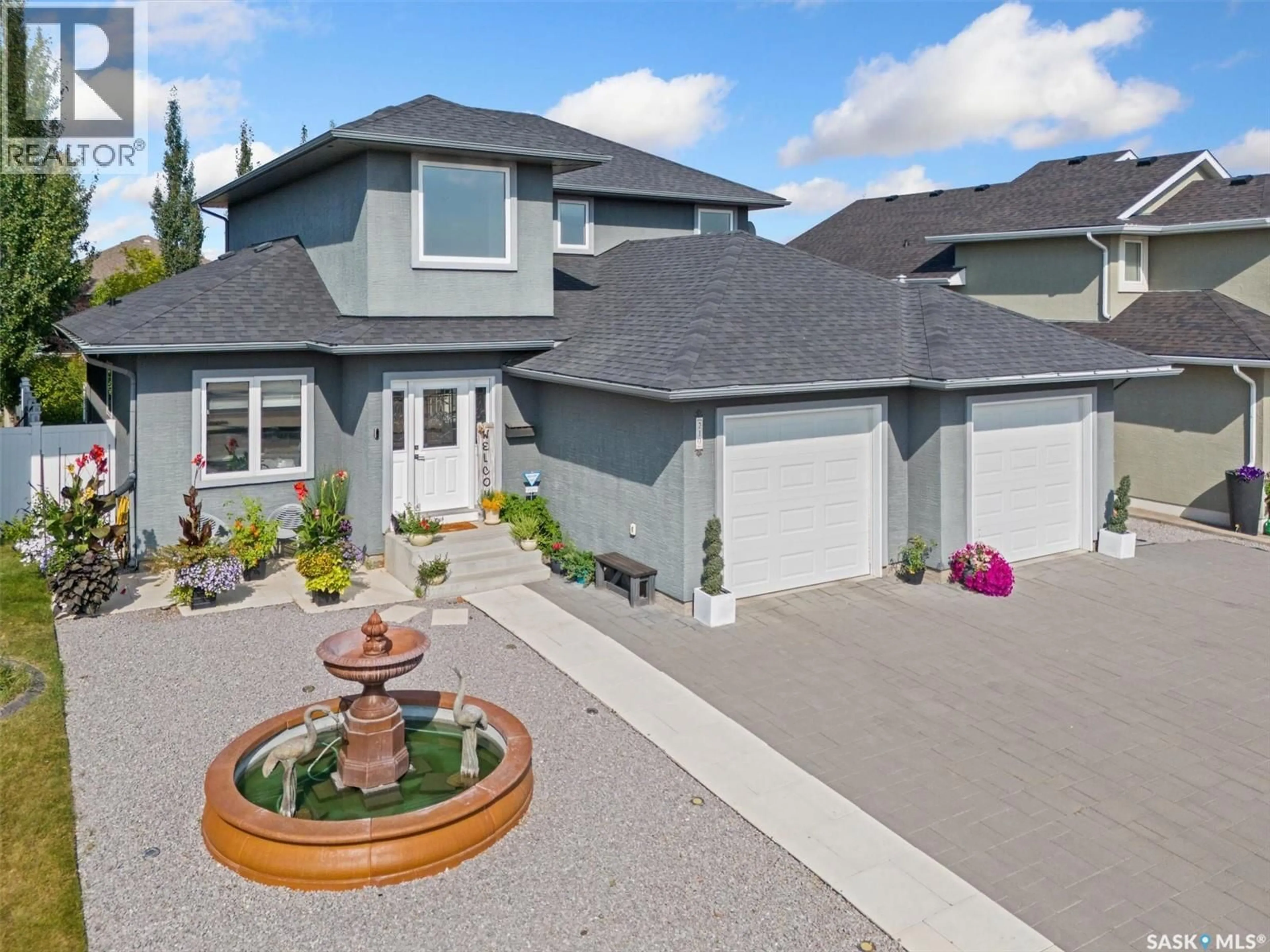 Home with vinyl exterior material, street for 210 CLUBHOUSE BOULEVARD, Warman Saskatchewan S0K4S1