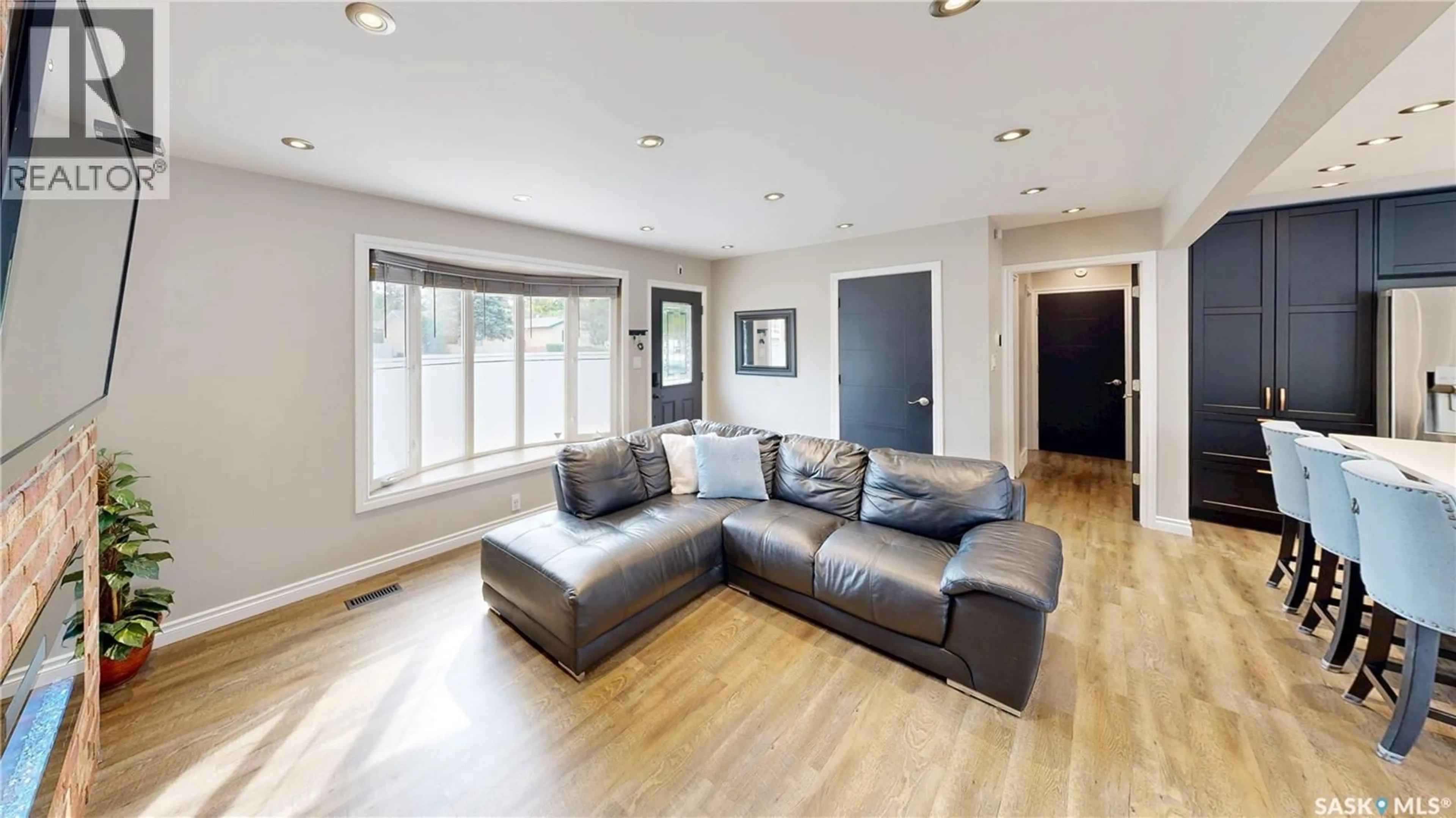 Living room with furniture, wood/laminate floor for 648 SNEDDON STREET, Regina Saskatchewan S4T6G9