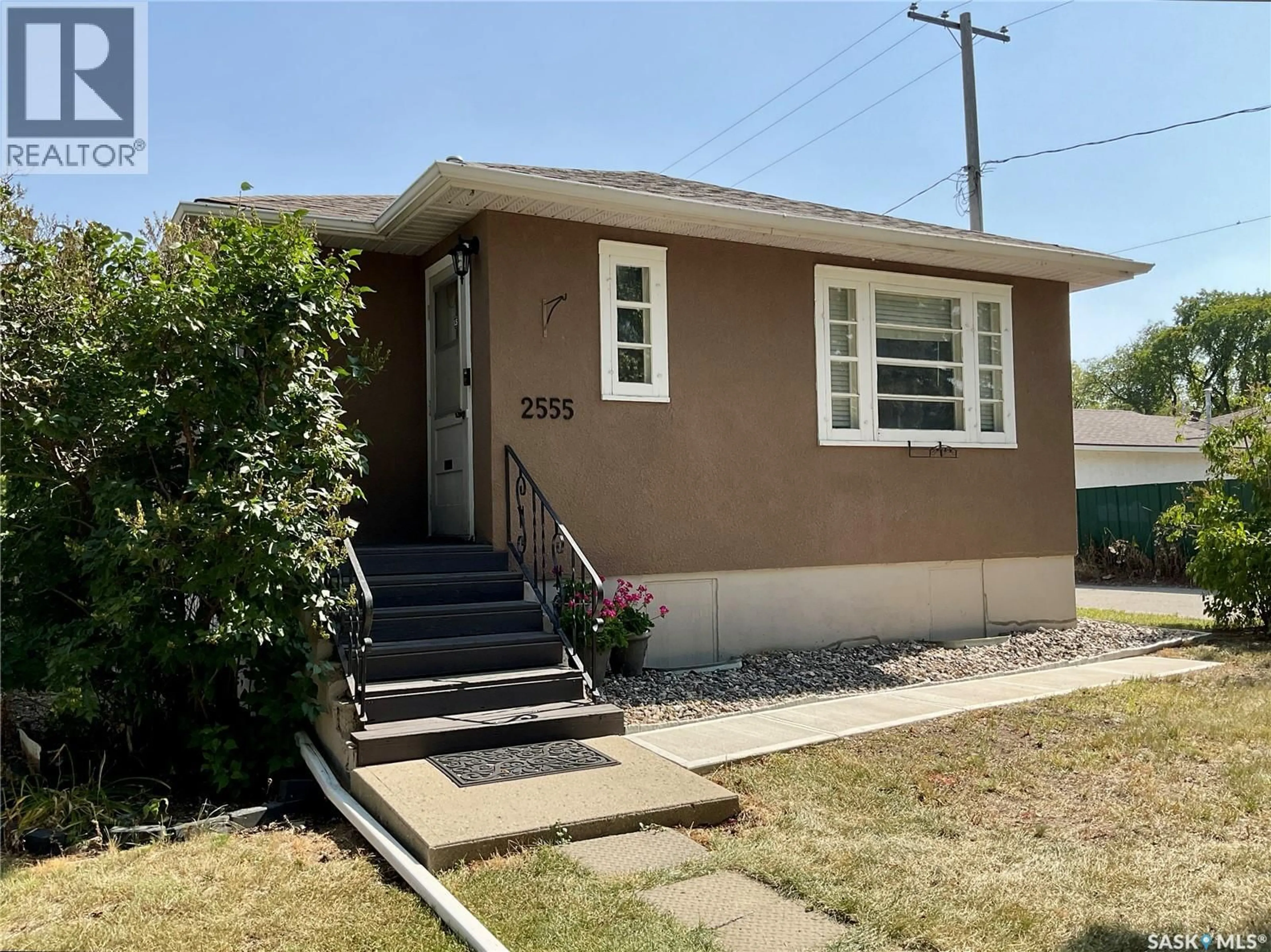 Home with vinyl exterior material, street for 2555 ELLIOTT STREET, Regina Saskatchewan S4N3H6