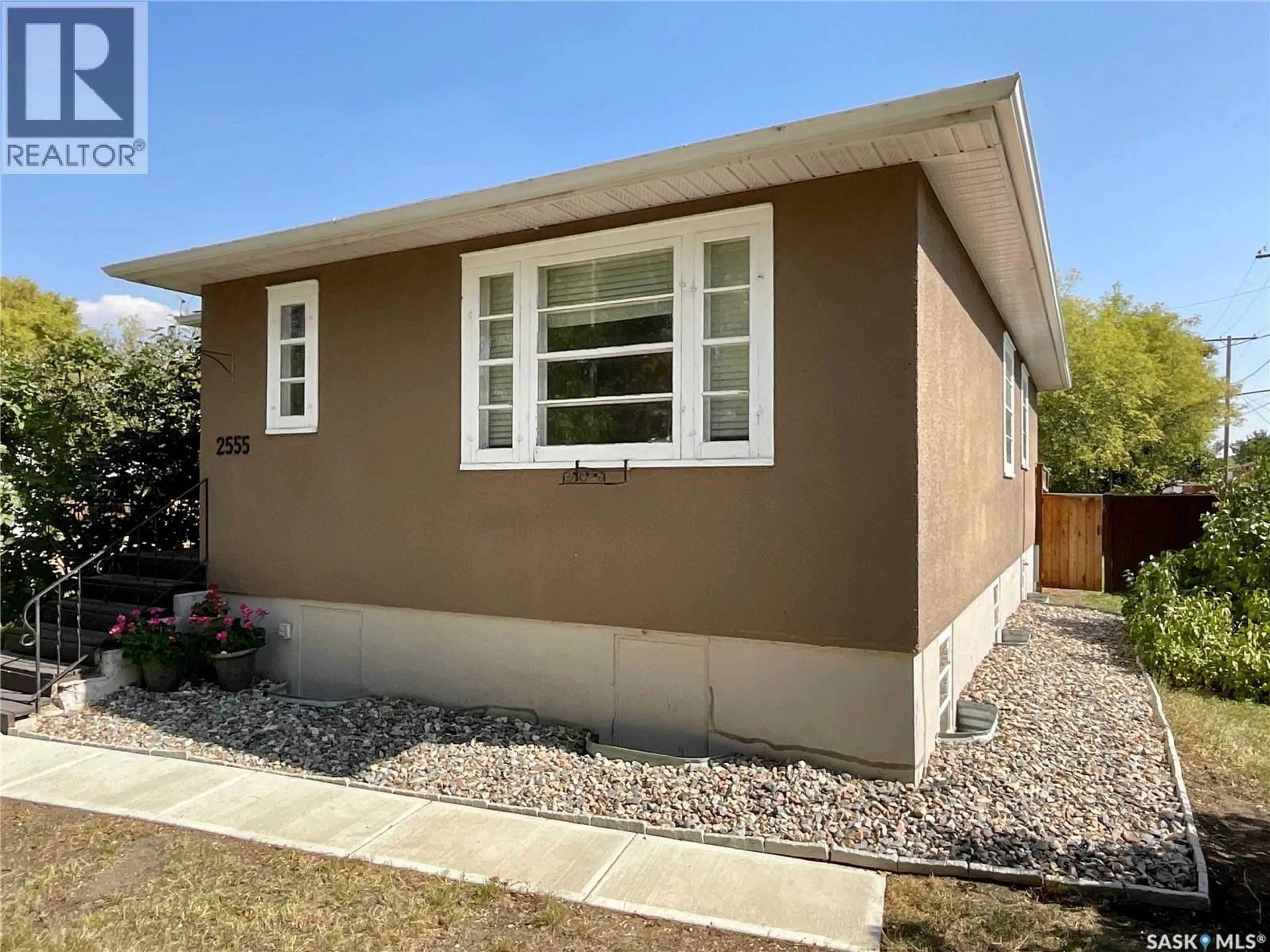 Home with vinyl exterior material, street for 2555 ELLIOTT STREET, Regina Saskatchewan S4N3H6