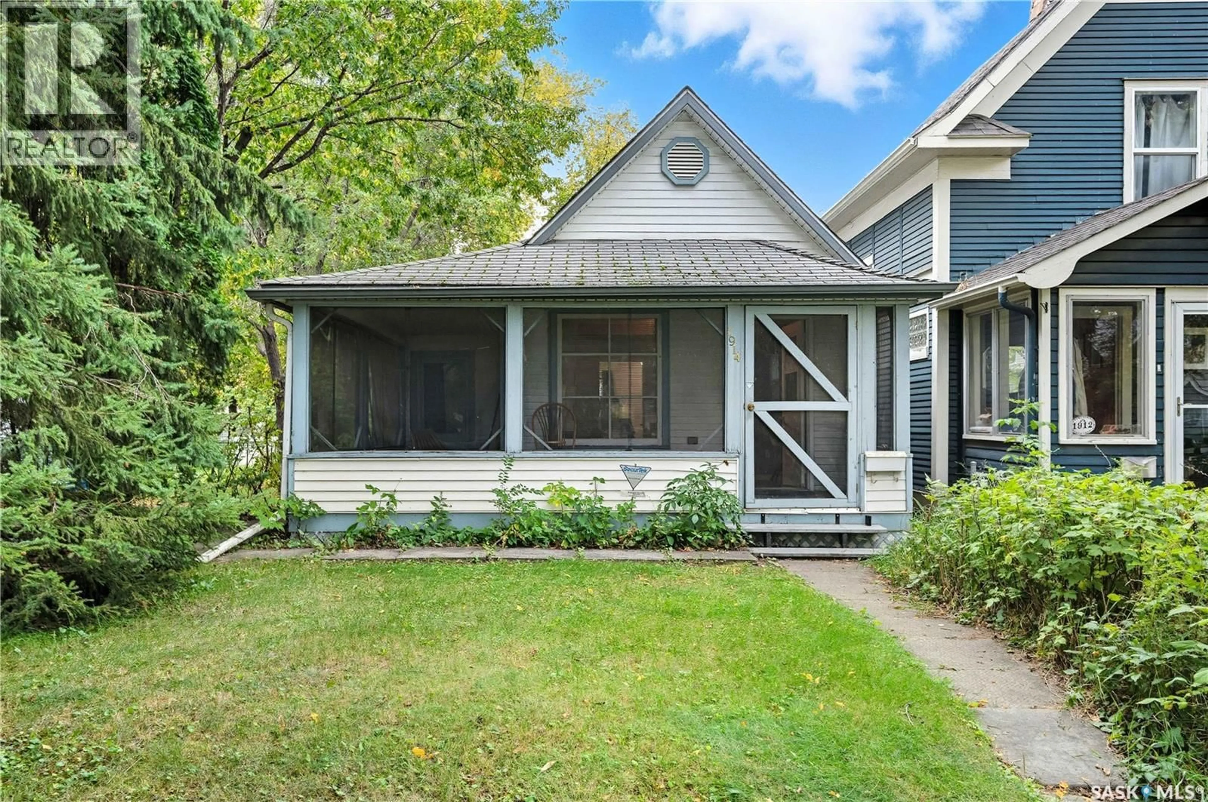 Home with vinyl exterior material, street for 1914 COY AVENUE, Saskatoon Saskatchewan S7M0J1
